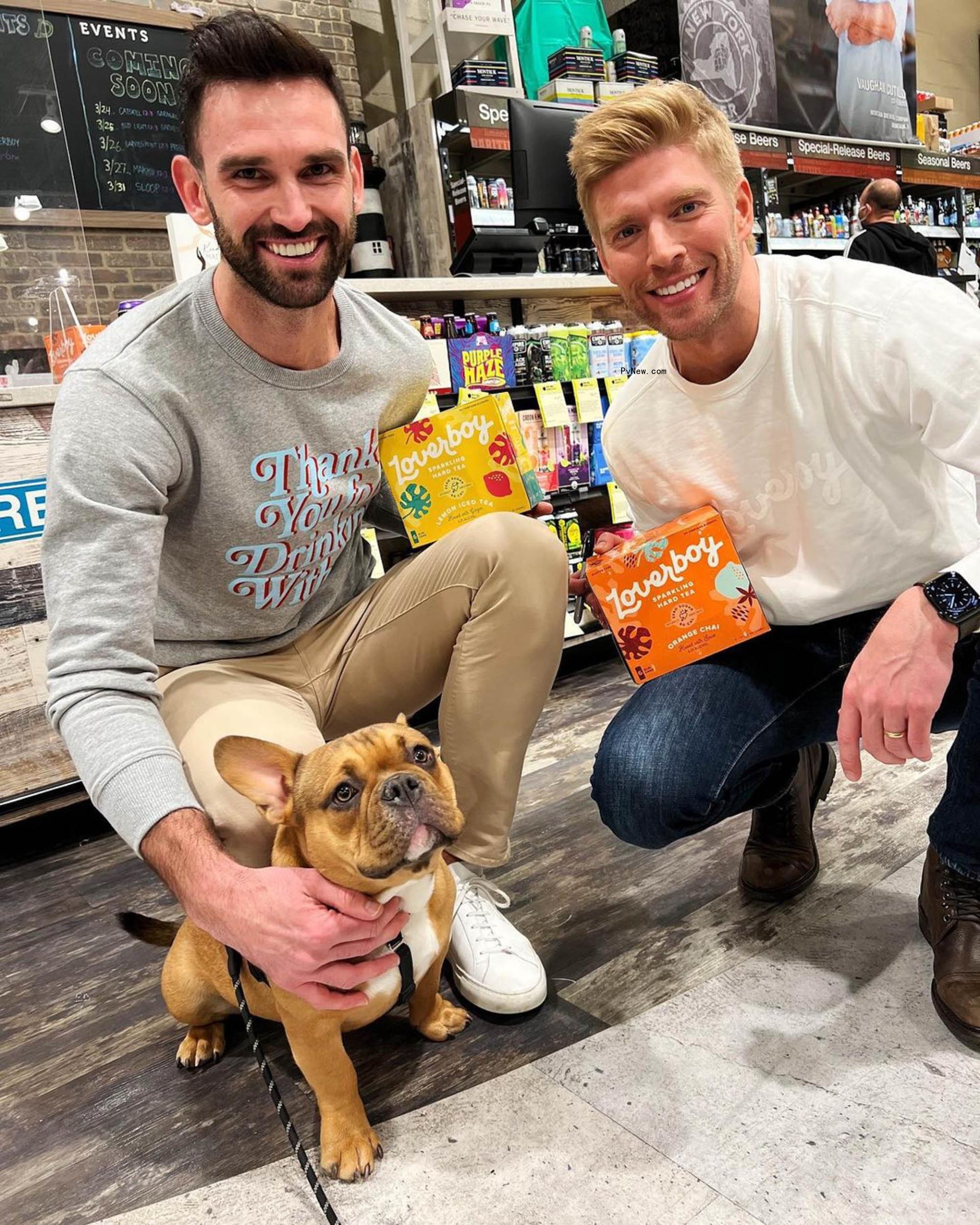 Carl Radke and Kyle Cooke with a dog