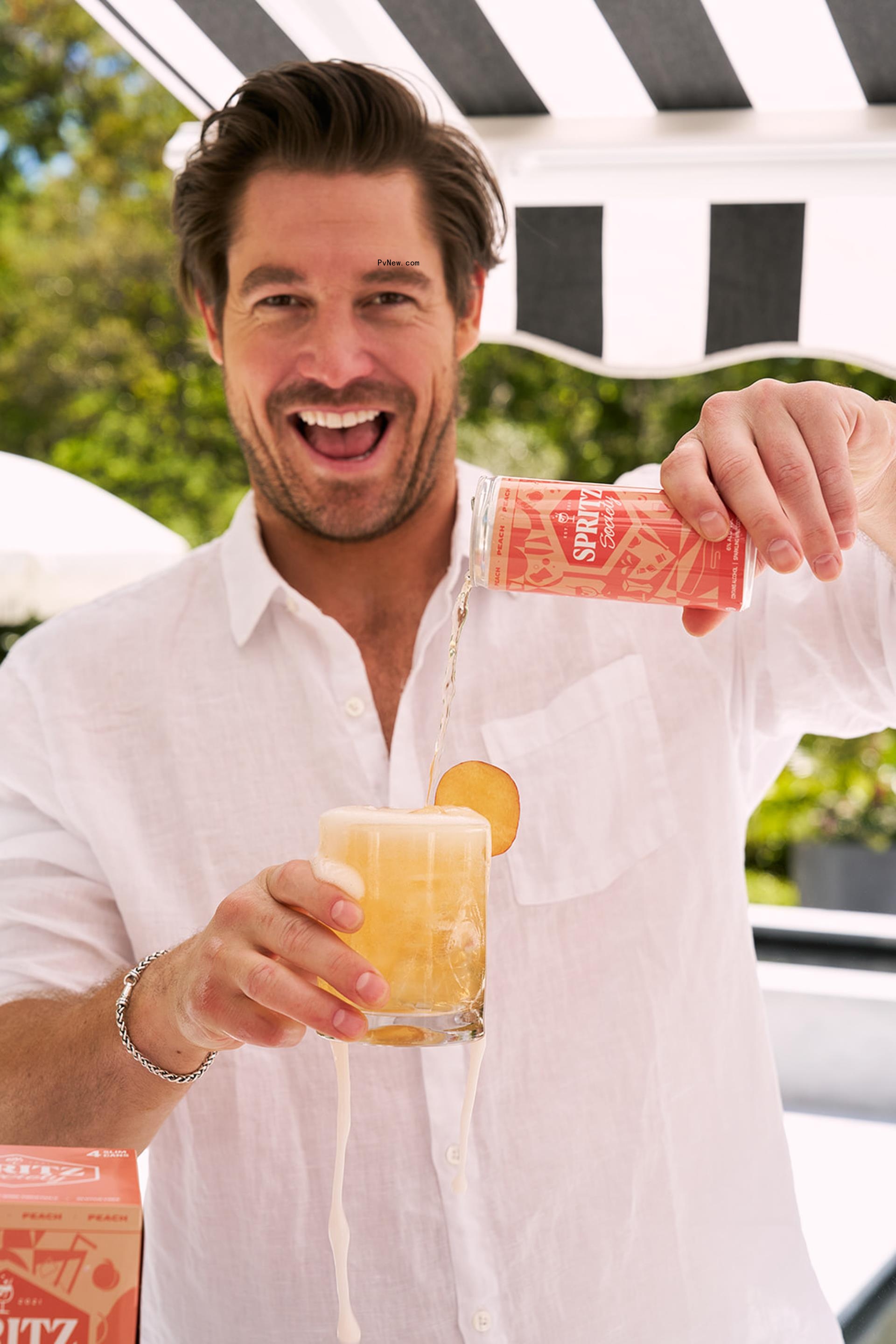 Craig Co<i></i>nover pouring a drink