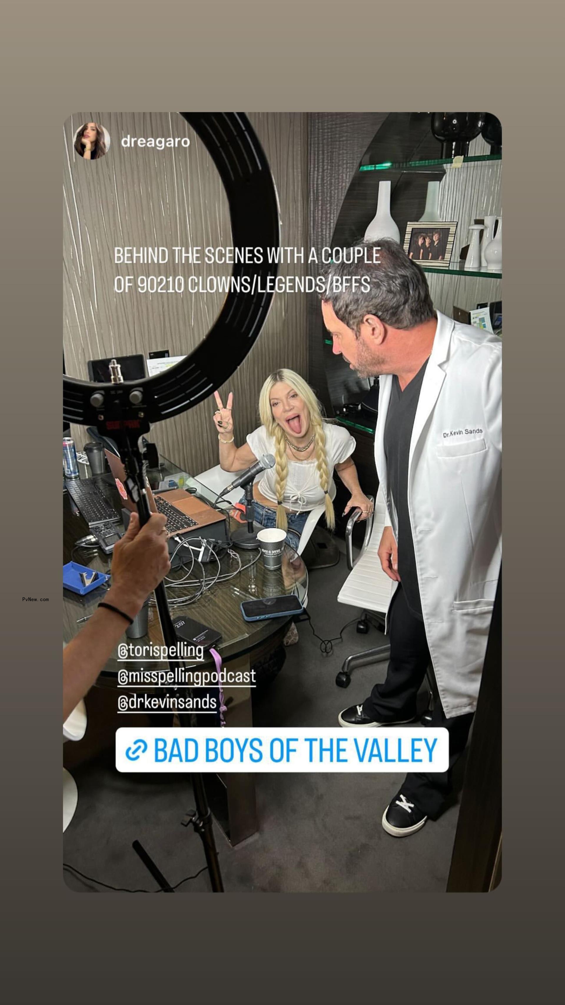 instagram photo of tori spelling giving the peace sign and sticking her to<i></i>ngue out standing next to dr. kevin sands