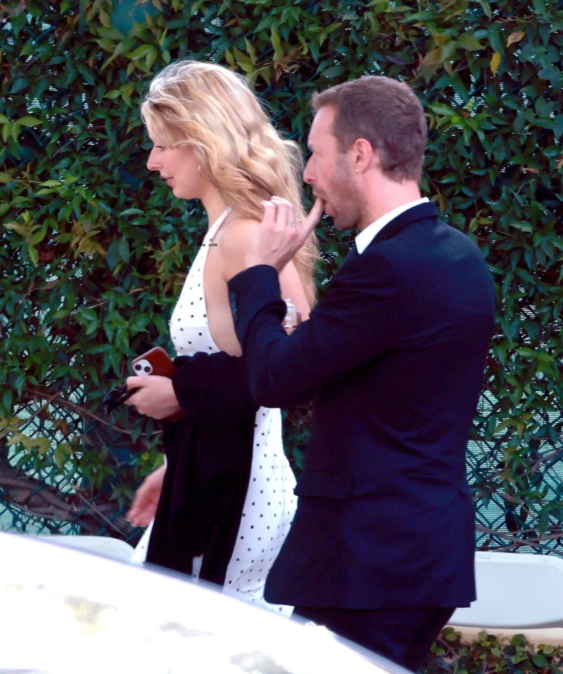 Chris Martin and Apple at Moses' graduation.