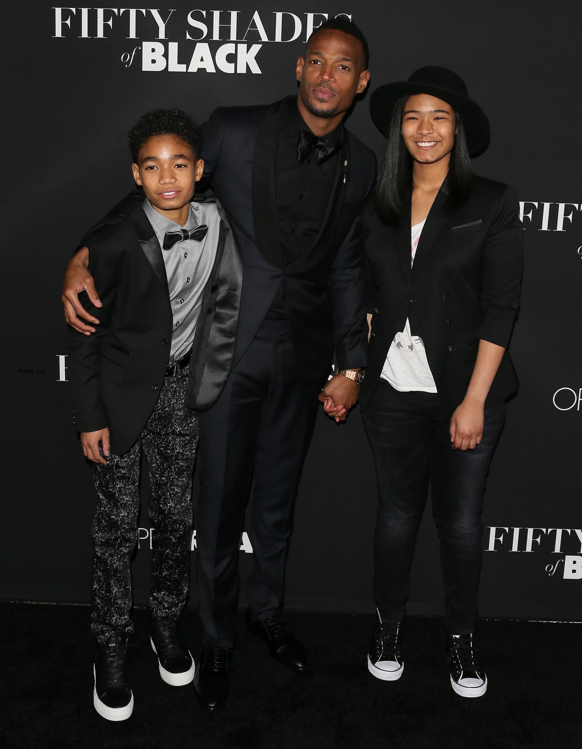 Marlon Wayans with Shawn and Kai on a red carpet in 2016. 