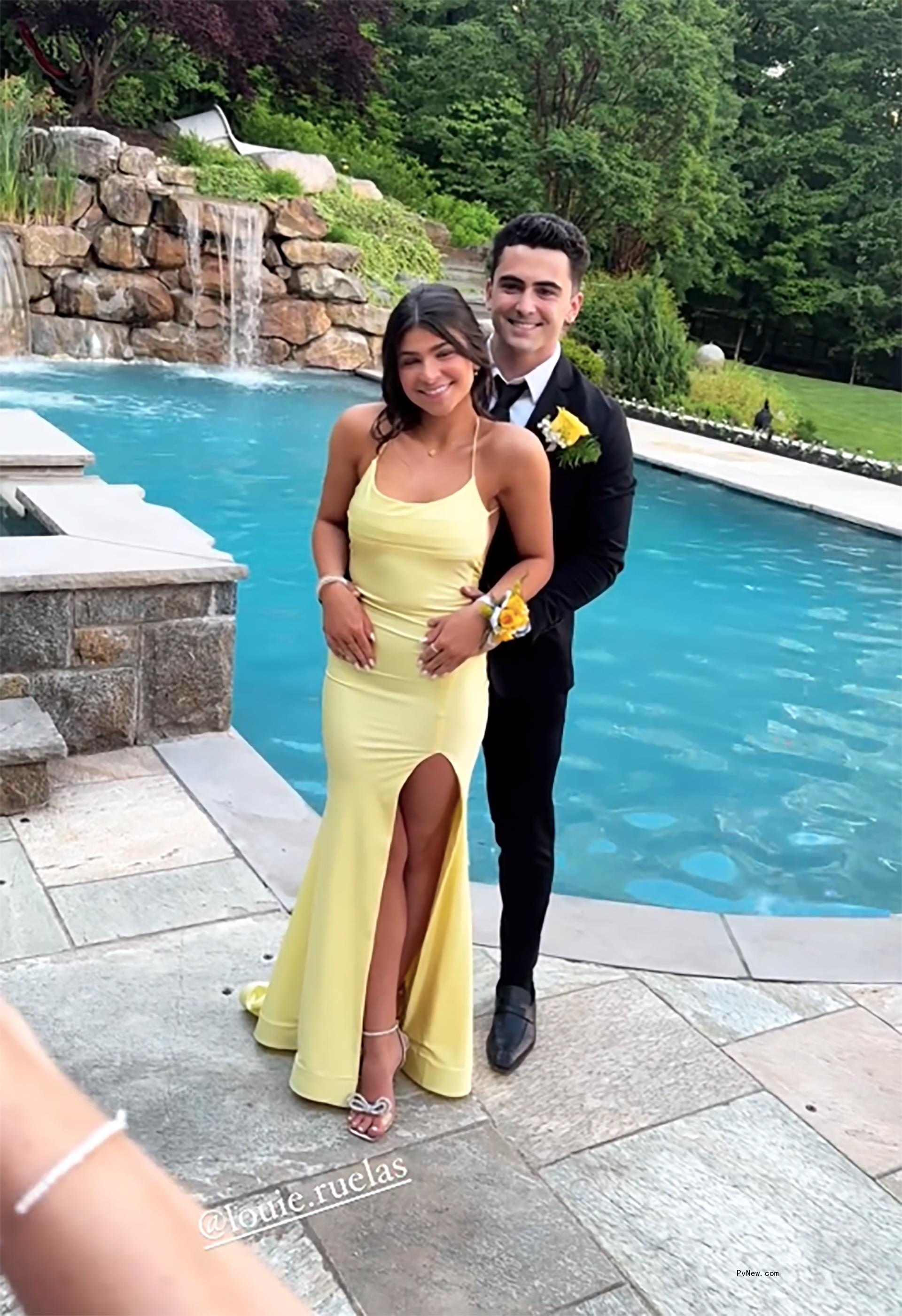 Louie Ruelas Jr. posing with a friend for prom