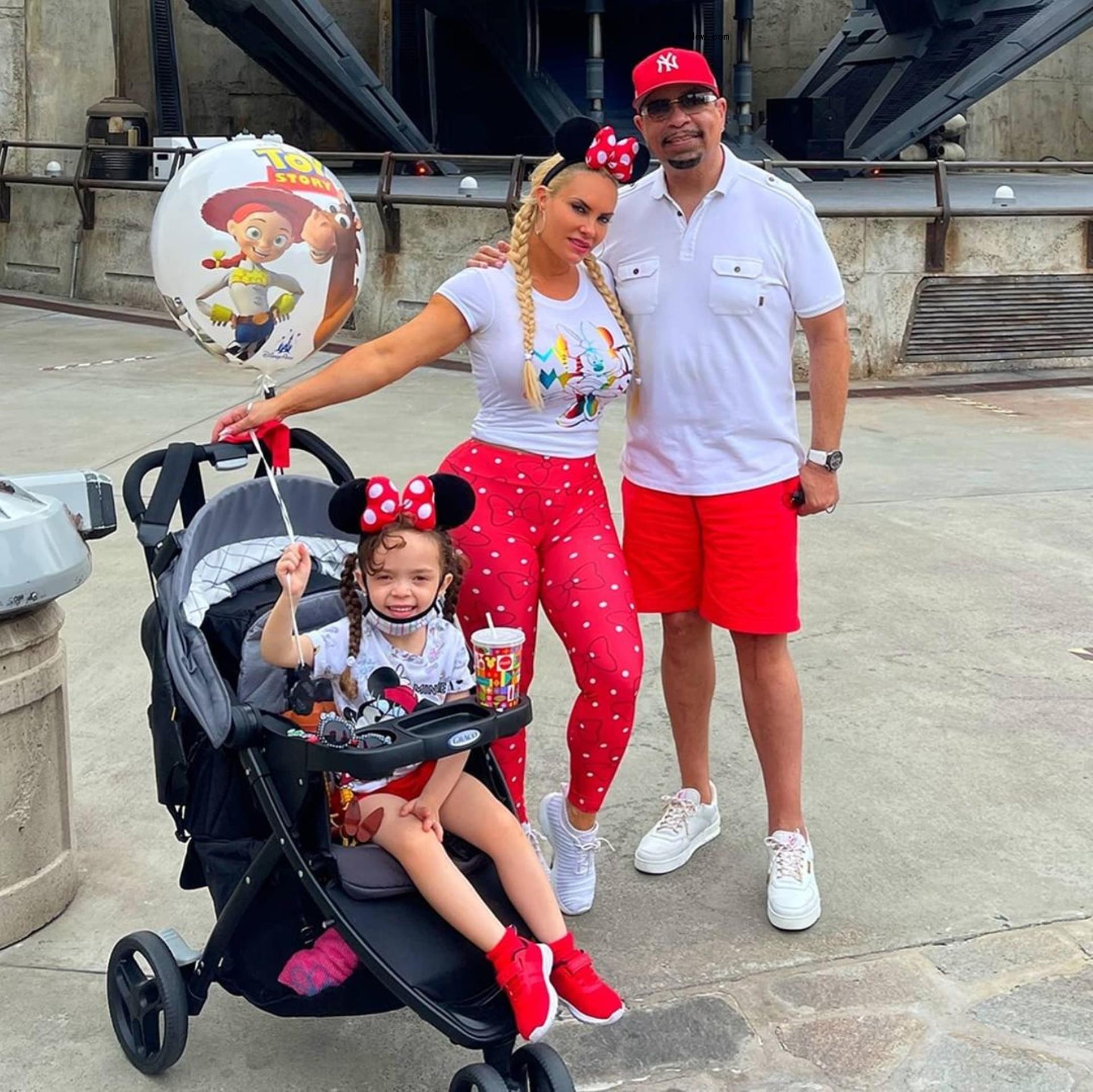 Ice-T and Coco Austin posing with their daughter in a stroller