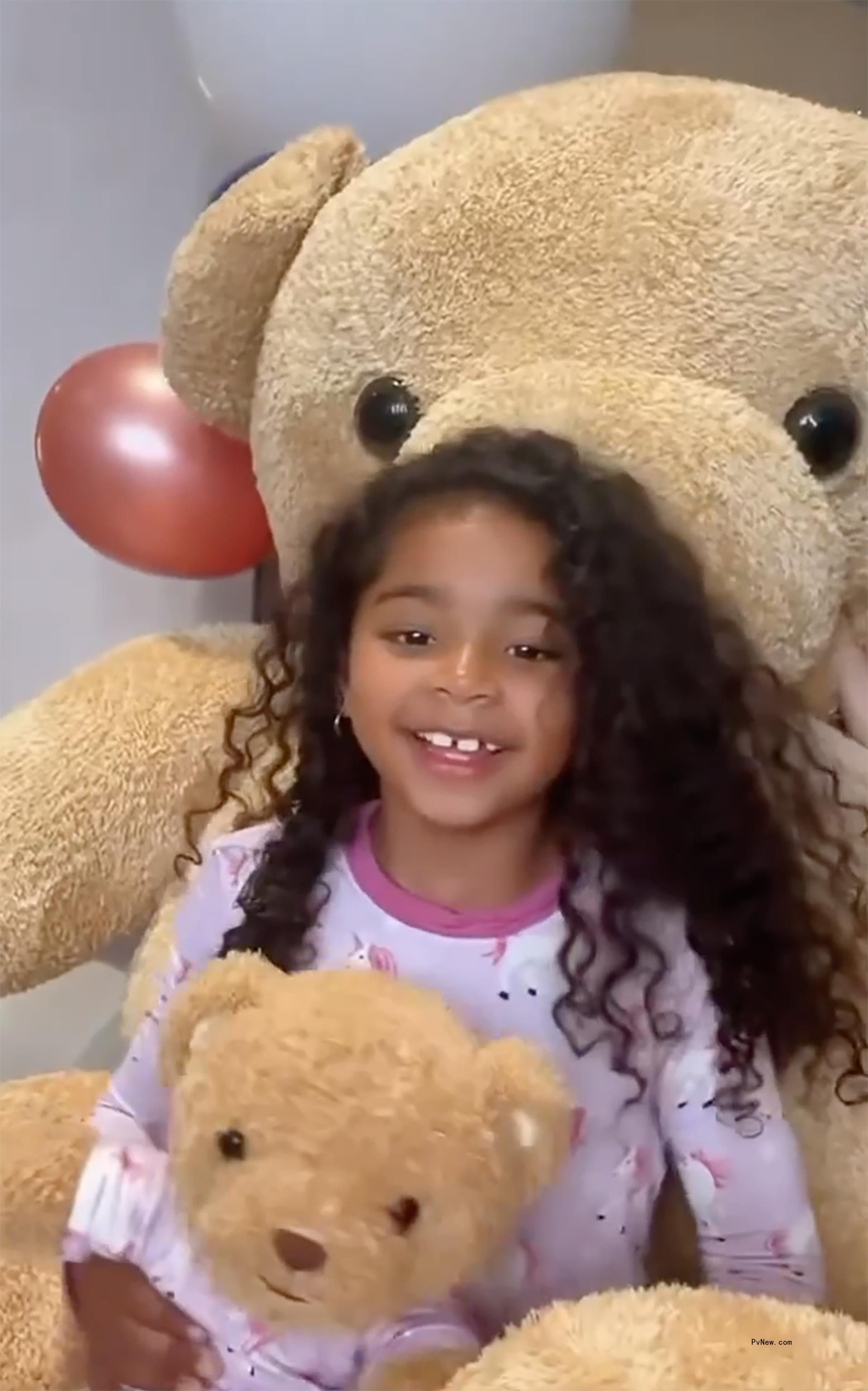 True Thompson and a stuffed bear.