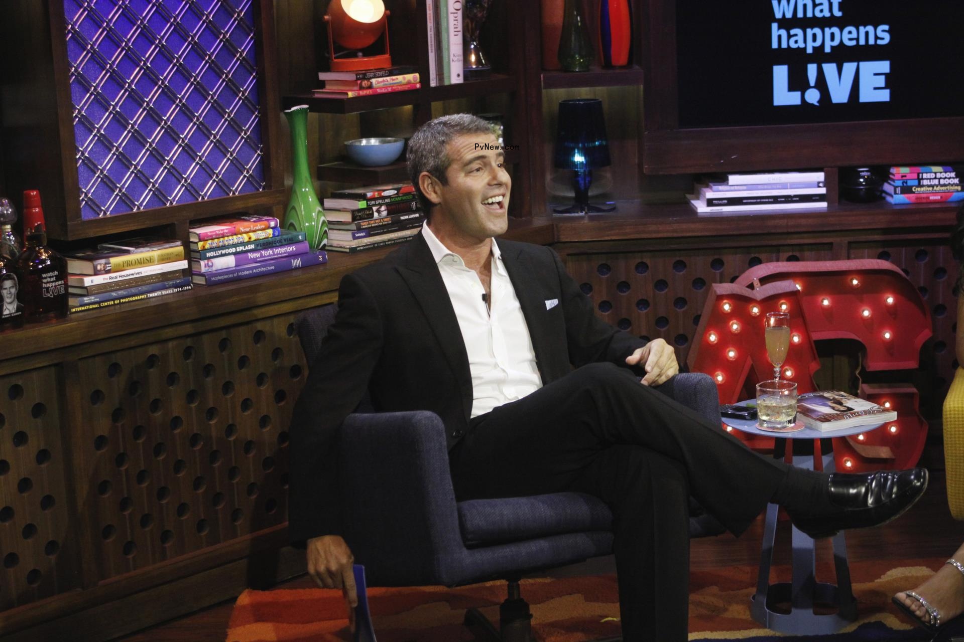 Andy Cohen sitting on