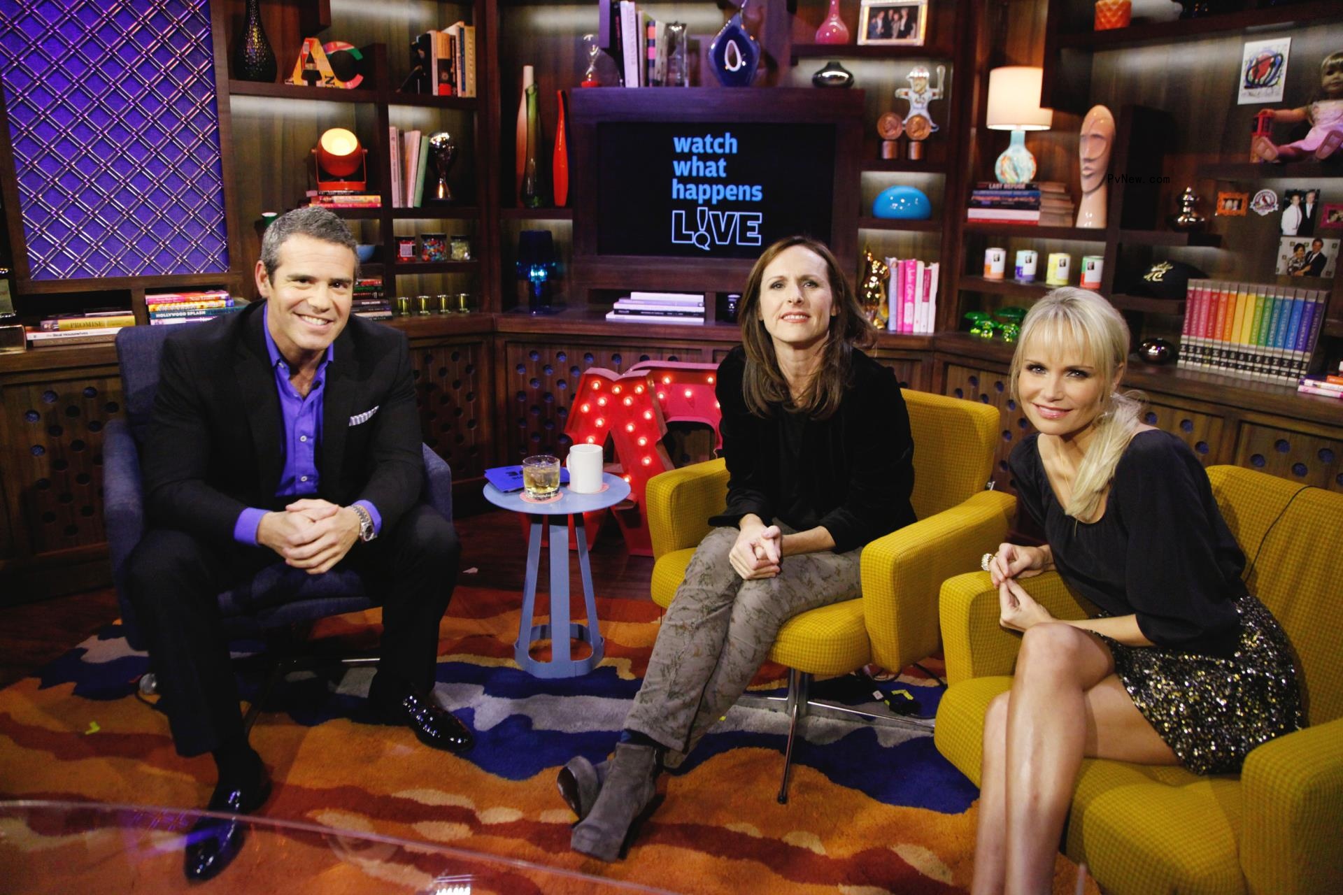 Molly Shannon and Kristin Chenoweth sitting with ANdy Cohen on