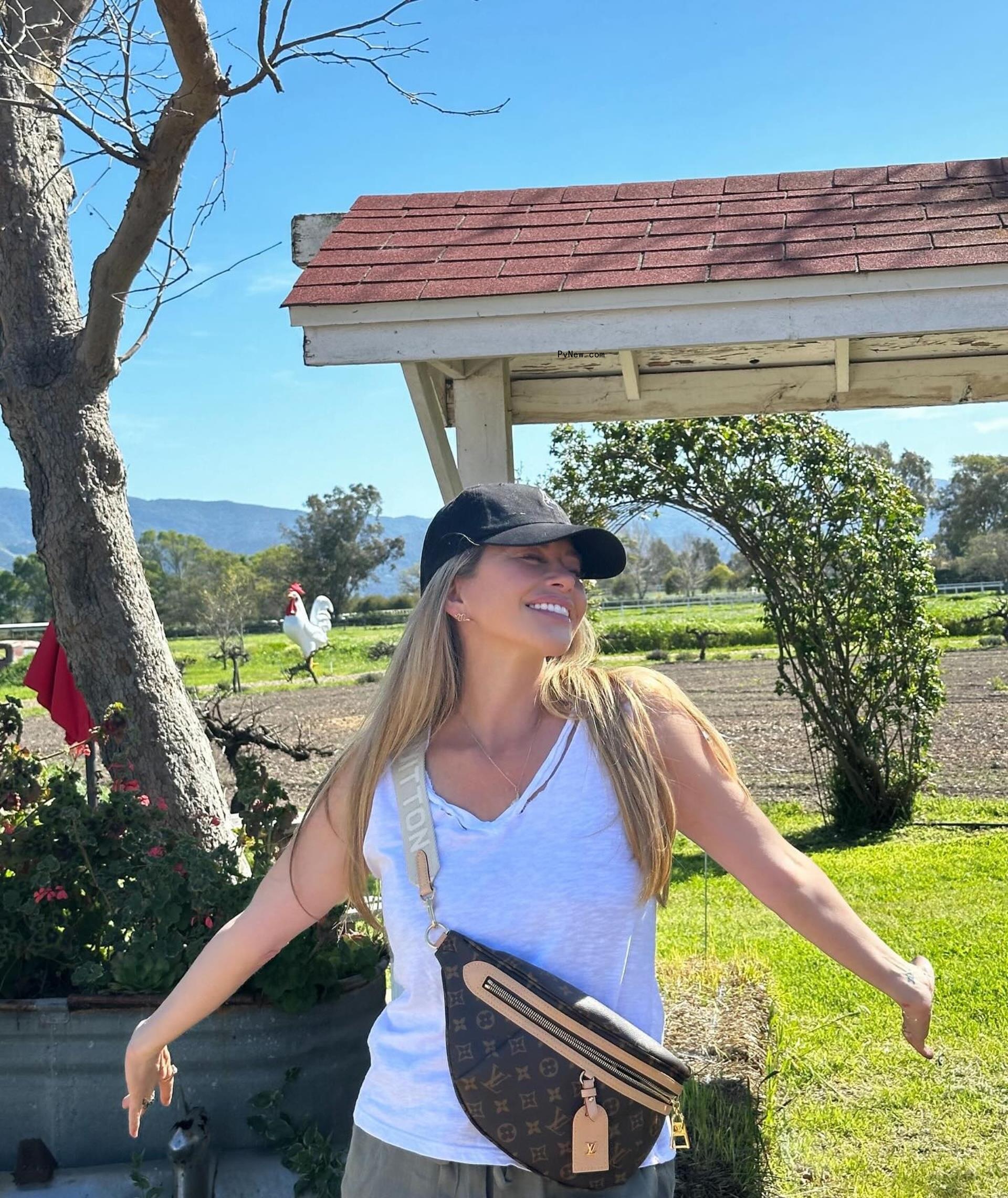 Dina Manzo smiling in a hat.