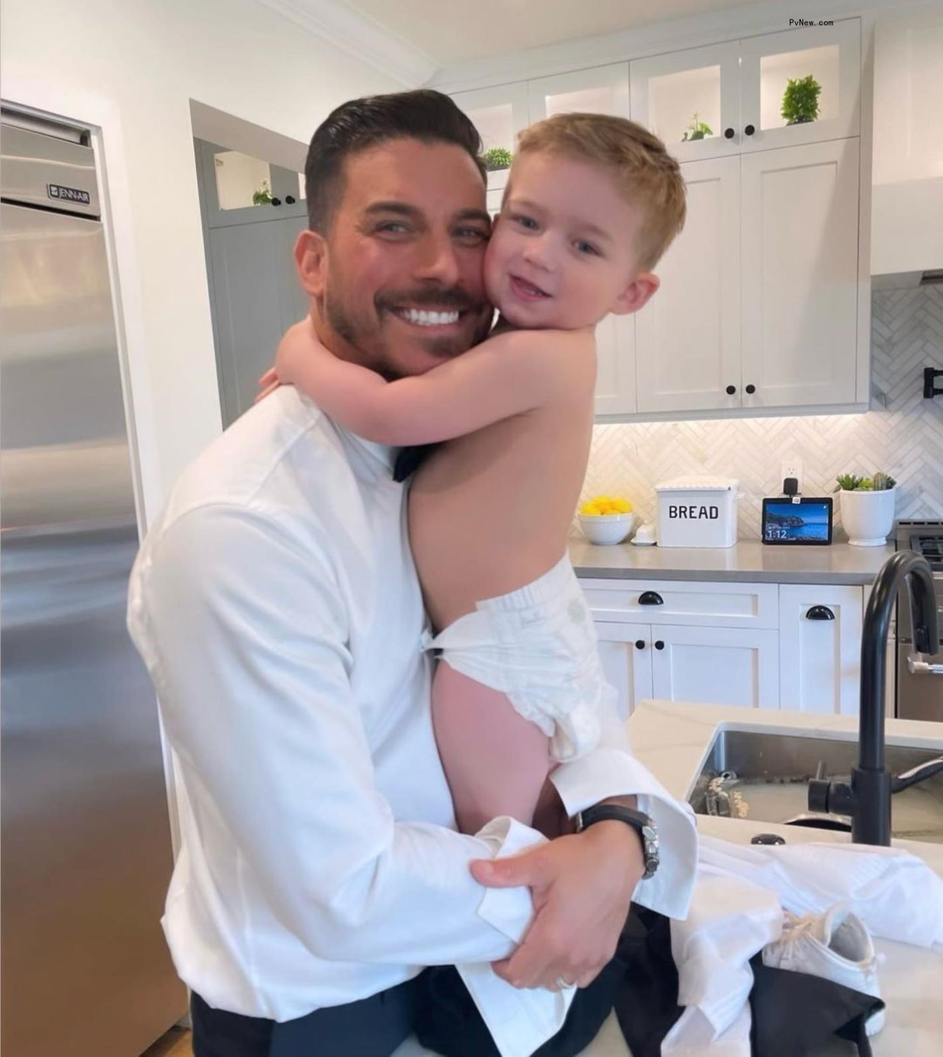 Jax Taylor holding his son