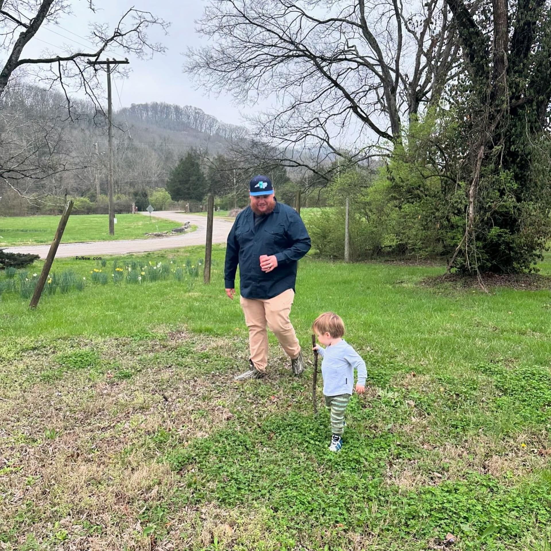 Luke Combs walking with son Tex