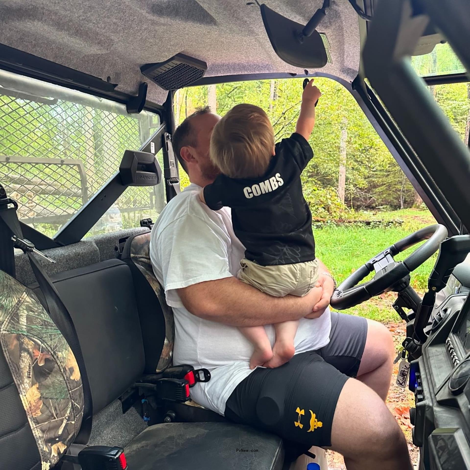 Luke Combs holding son Tex