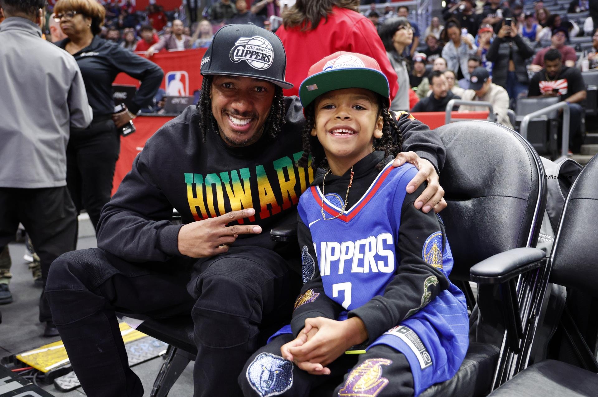 Nick Cannon and son Golden at a game.