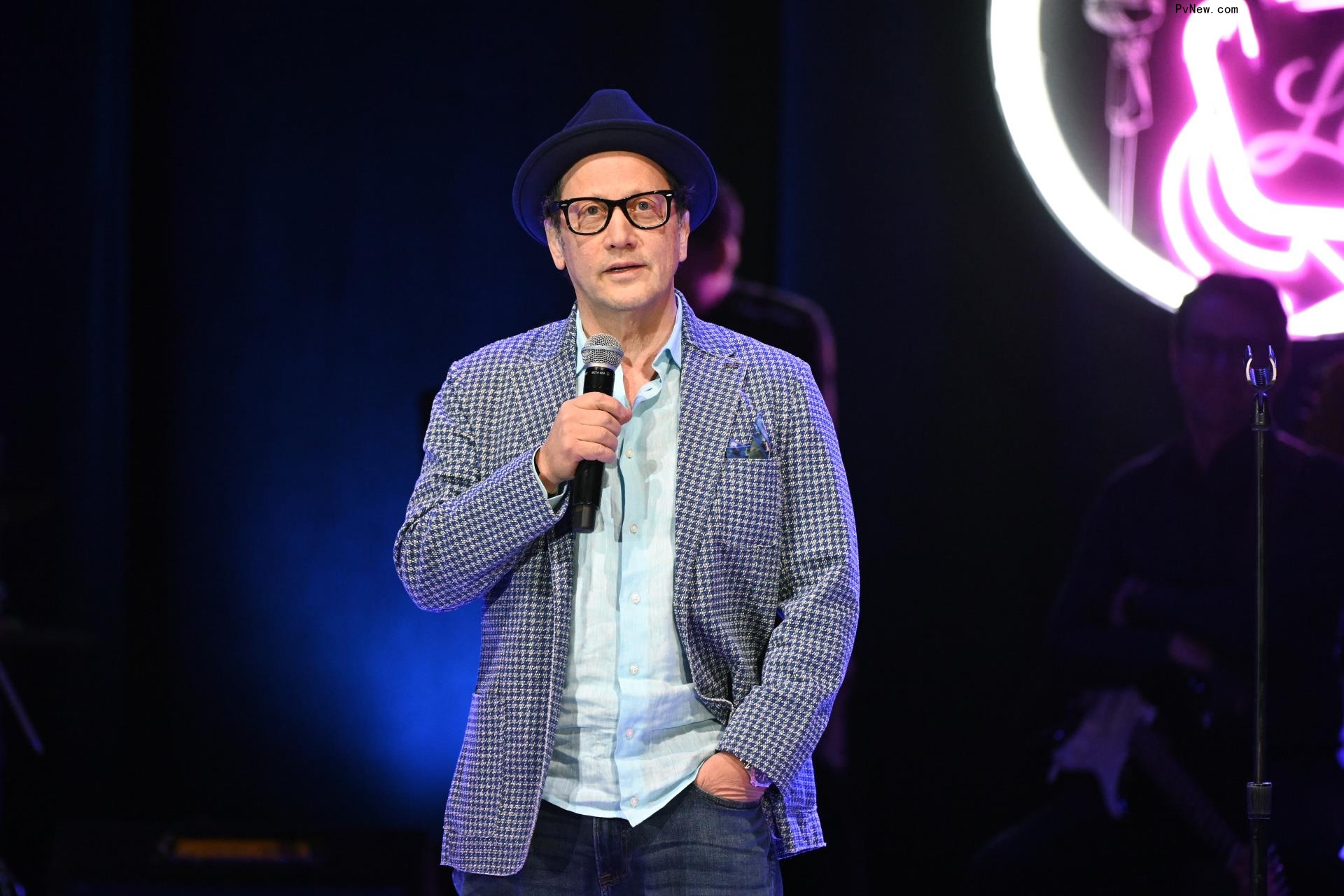 Rob Schneider onstage.