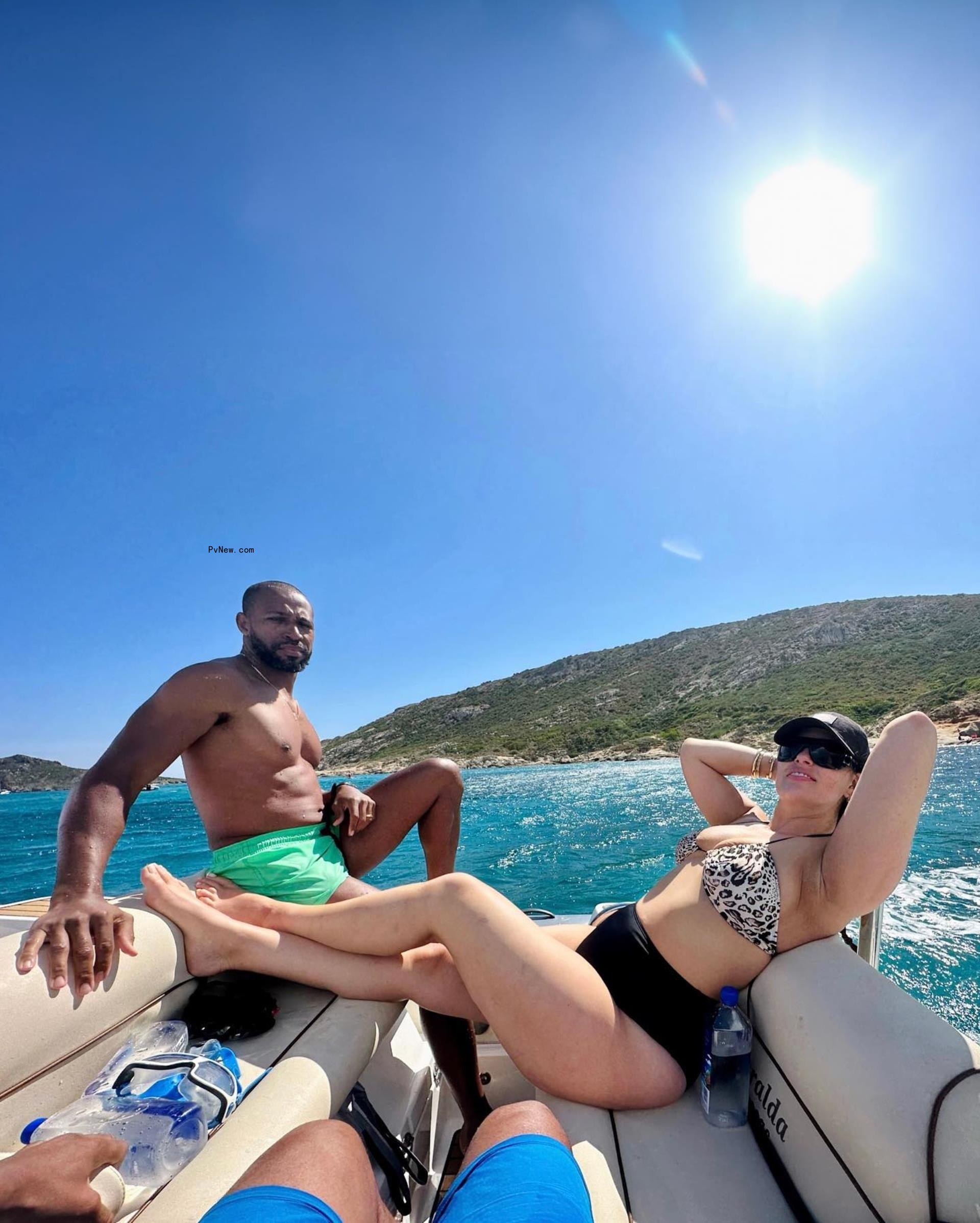 Ashley Graham and Justin Ervin on a boat. 