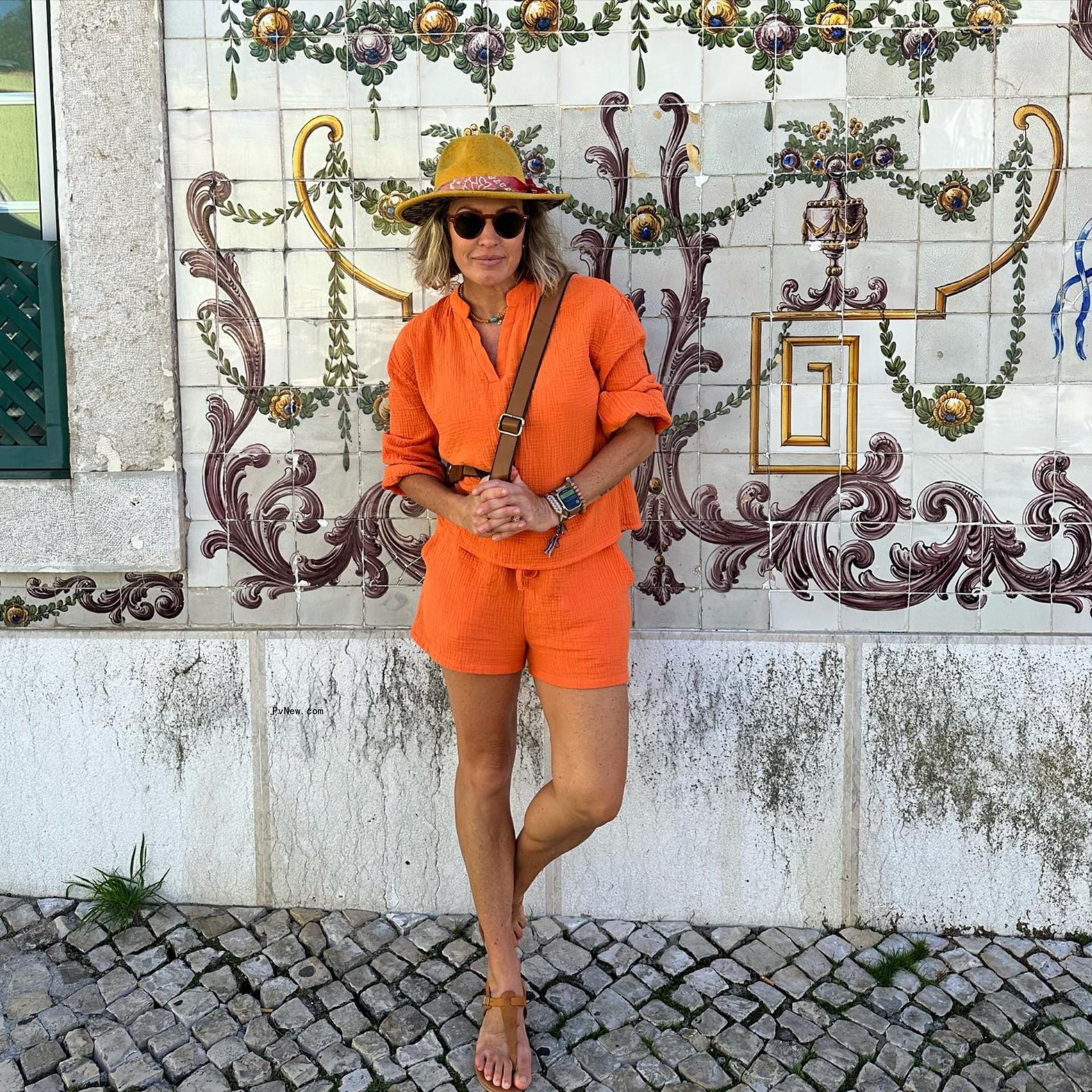 Braunwyn Windham-Burke in an orange outfit.
