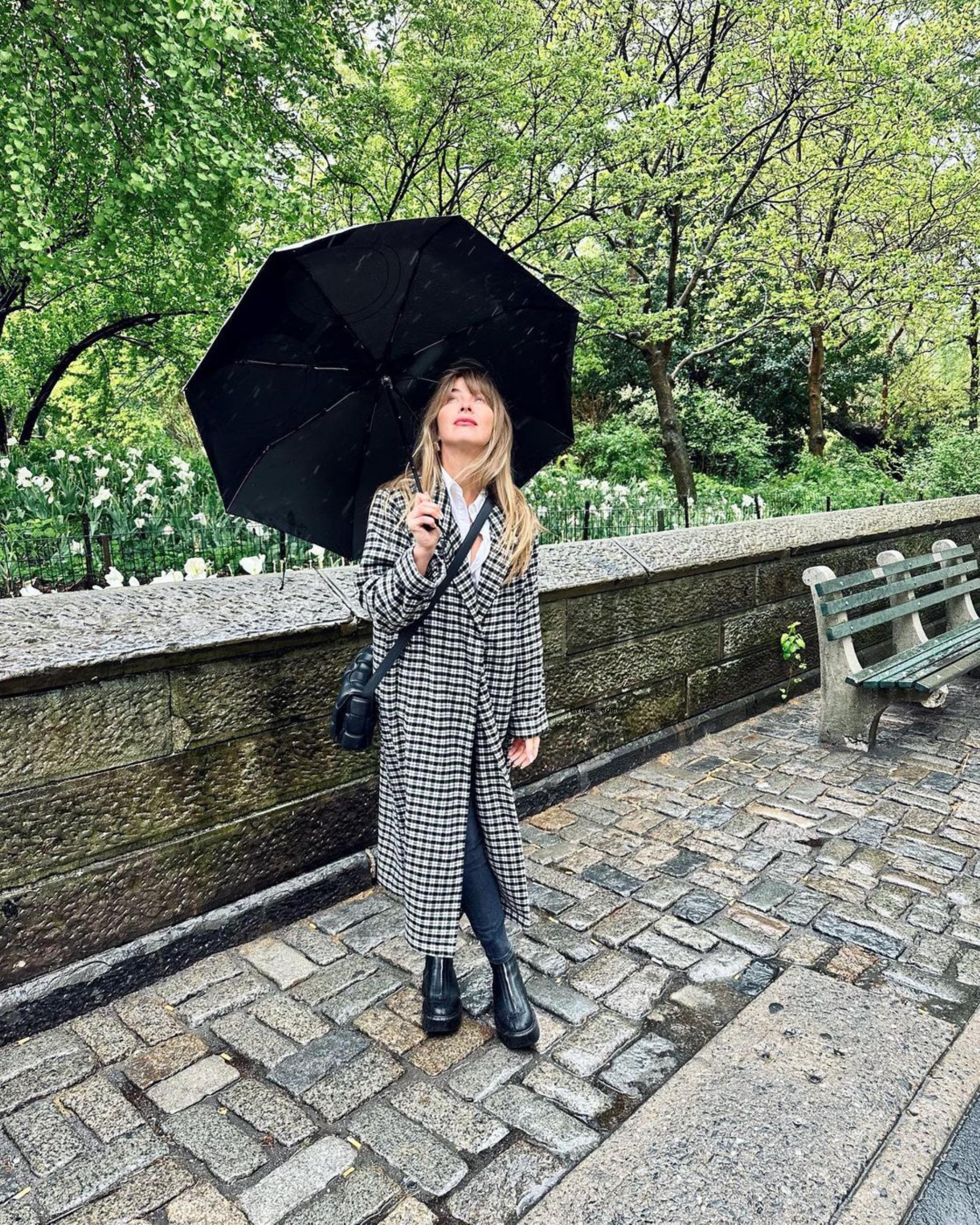 Julianne Hough holding an umbrella.