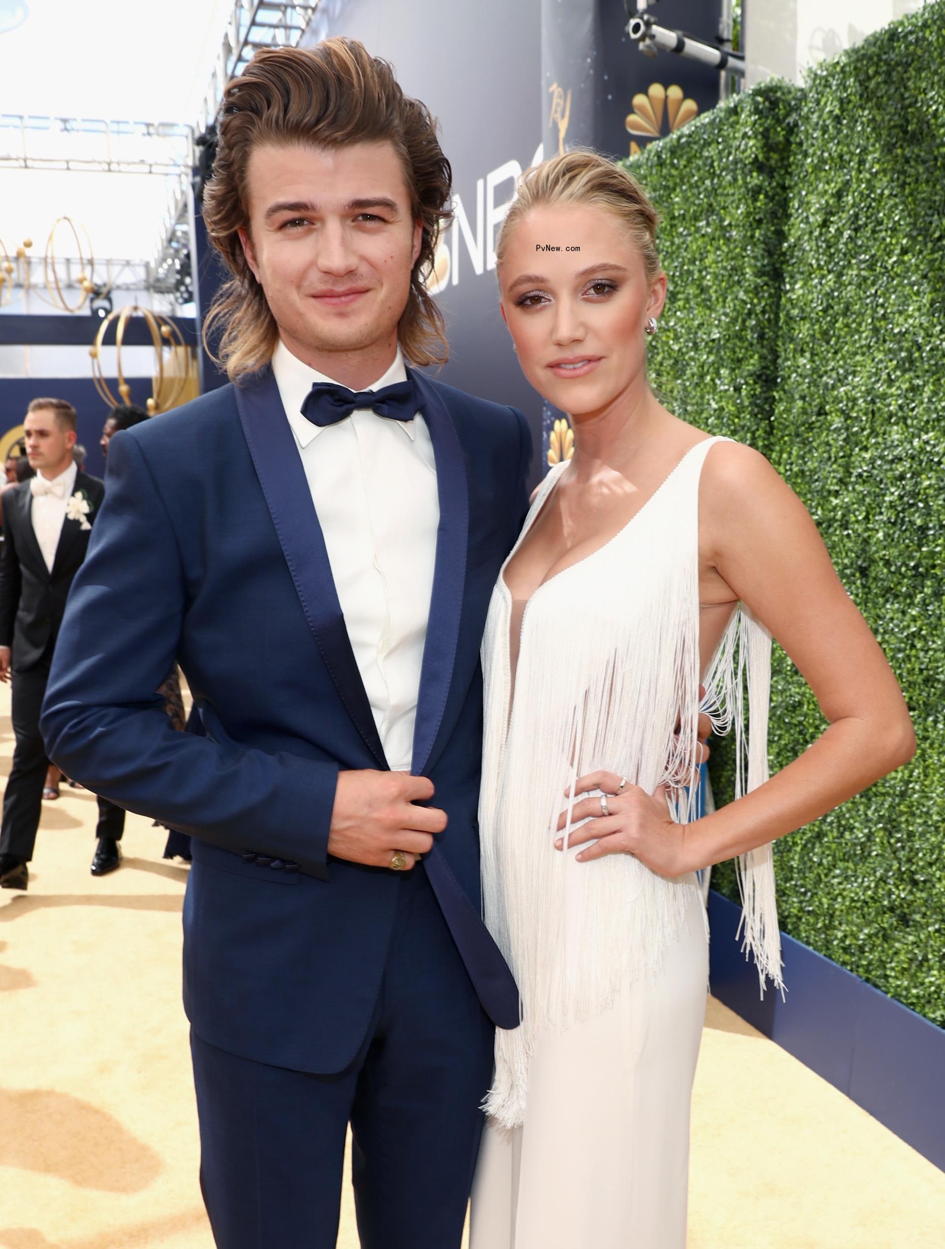 Joe Keery and Maika Mo<i></i>nroe posing together 