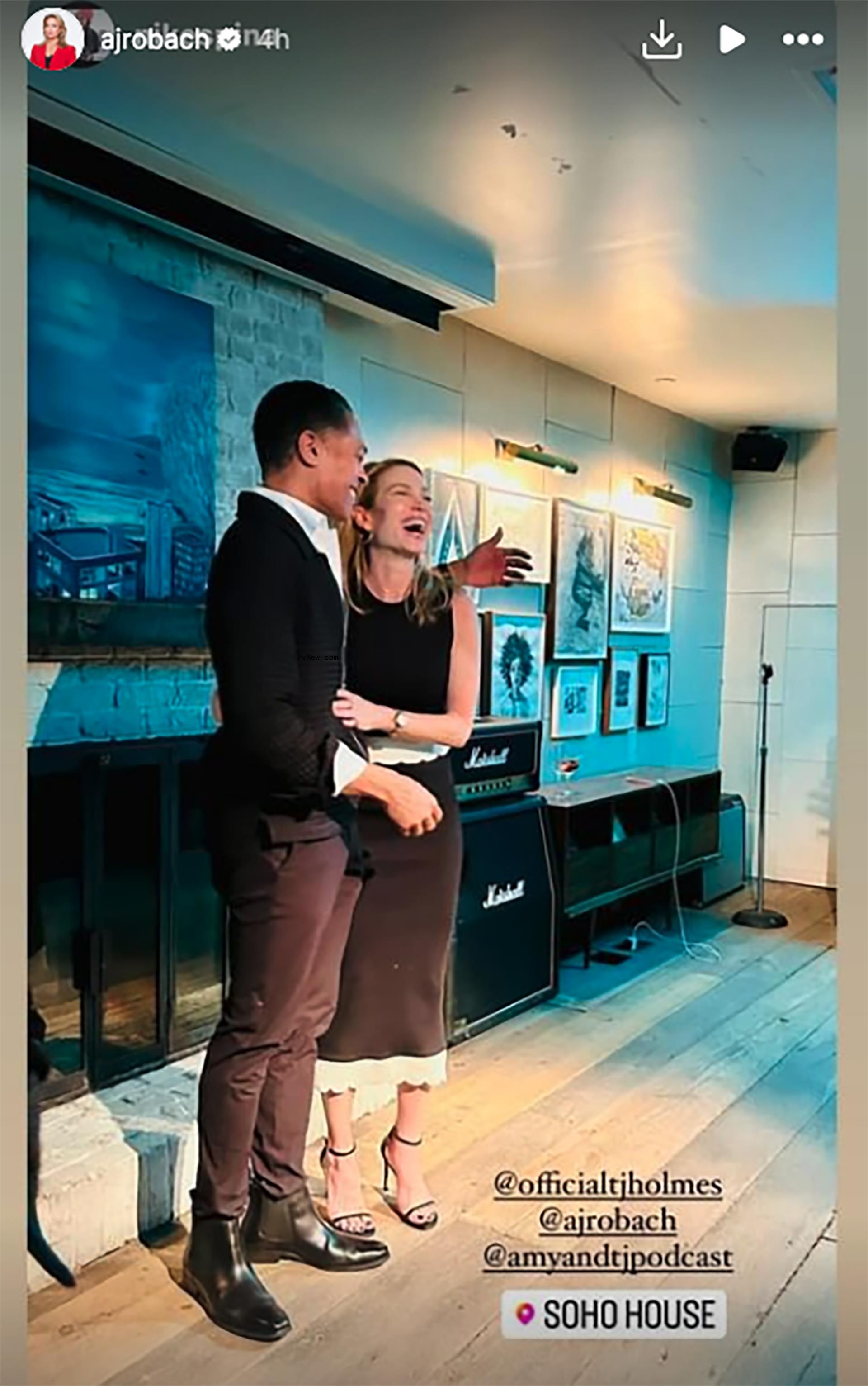 Amy Robach and TJ Holmes hugging
