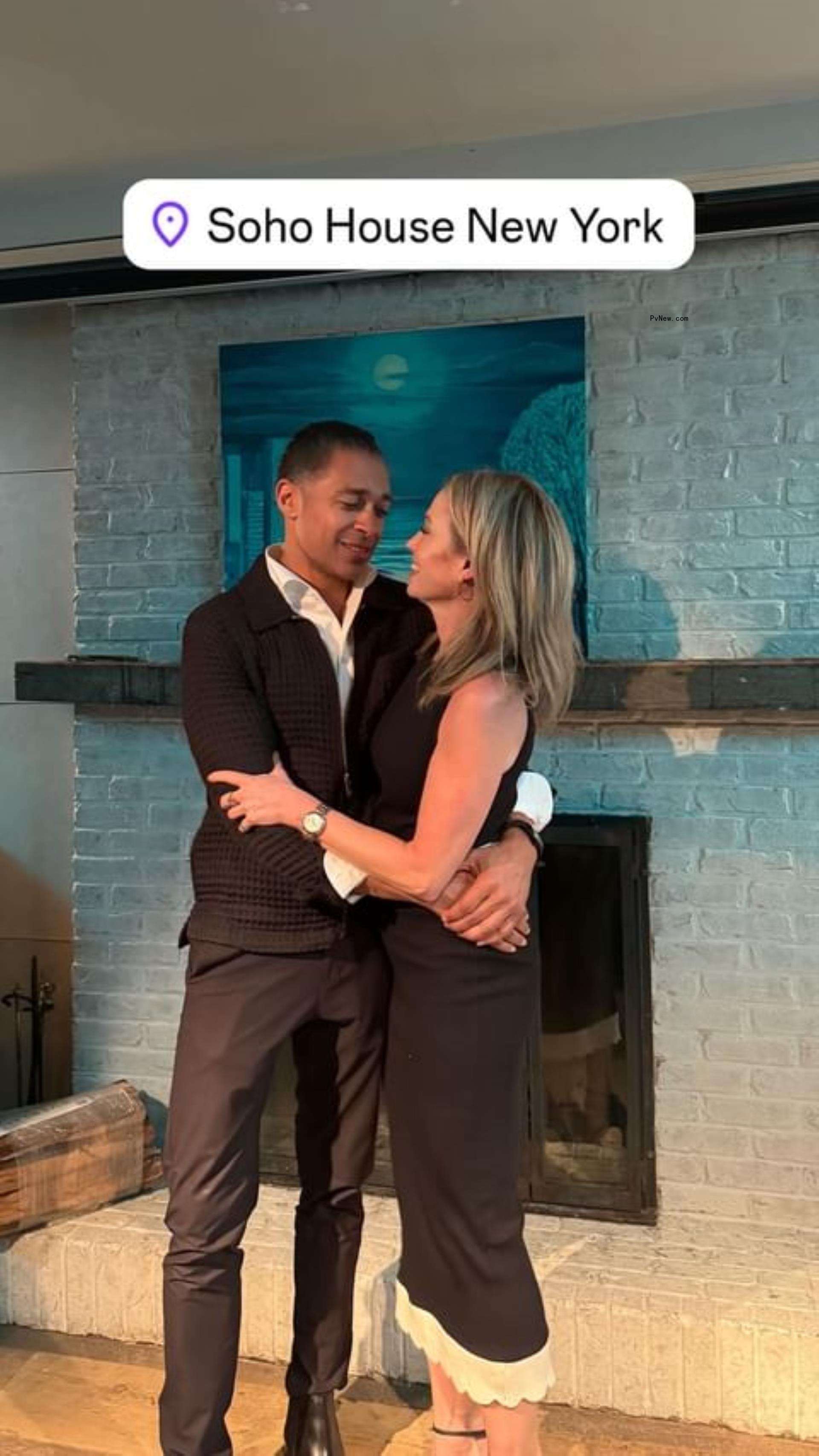 Amy Robach and TJ Holmes hugging