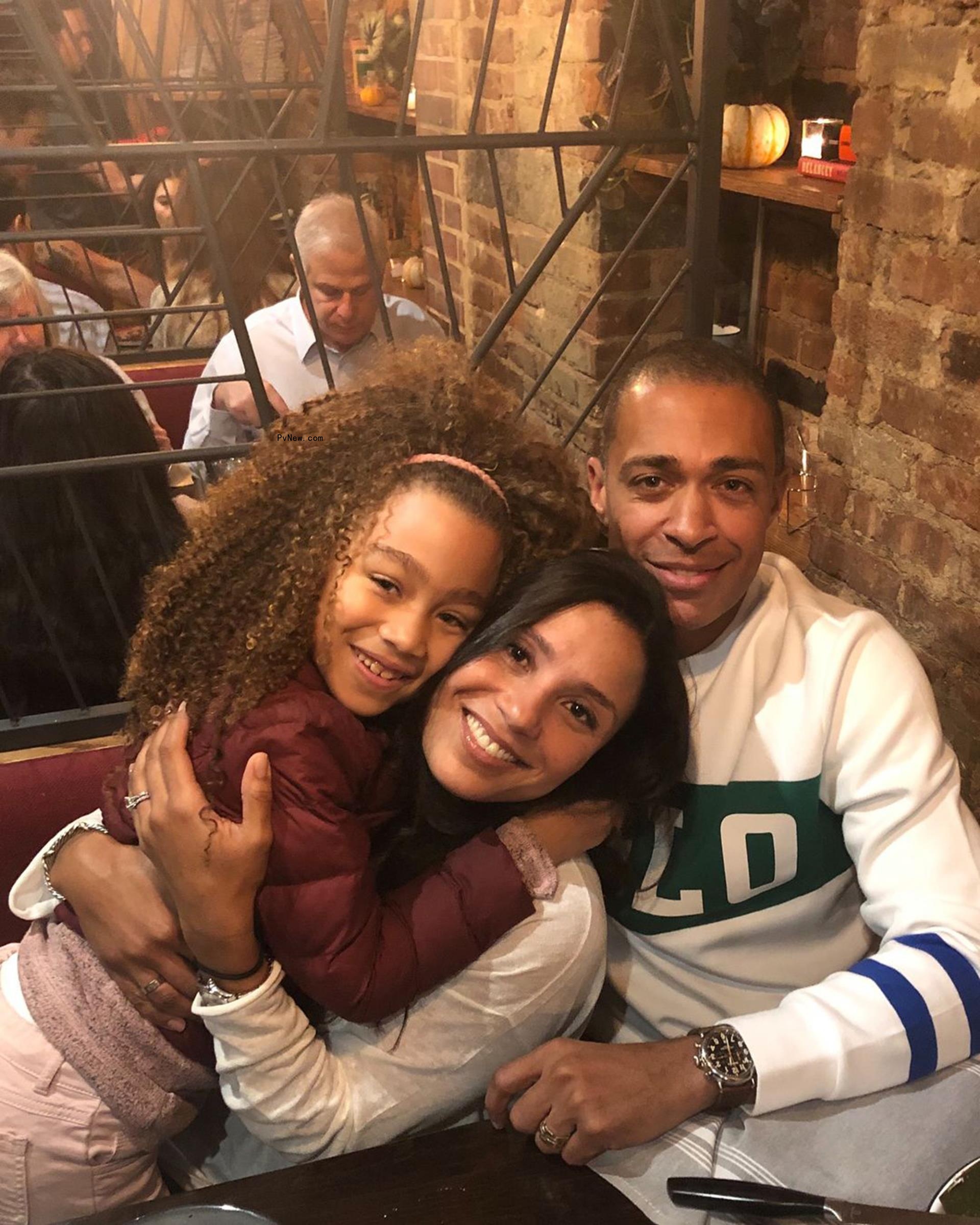 T.J. Holmes and Marilee Fiebig with their daughter.