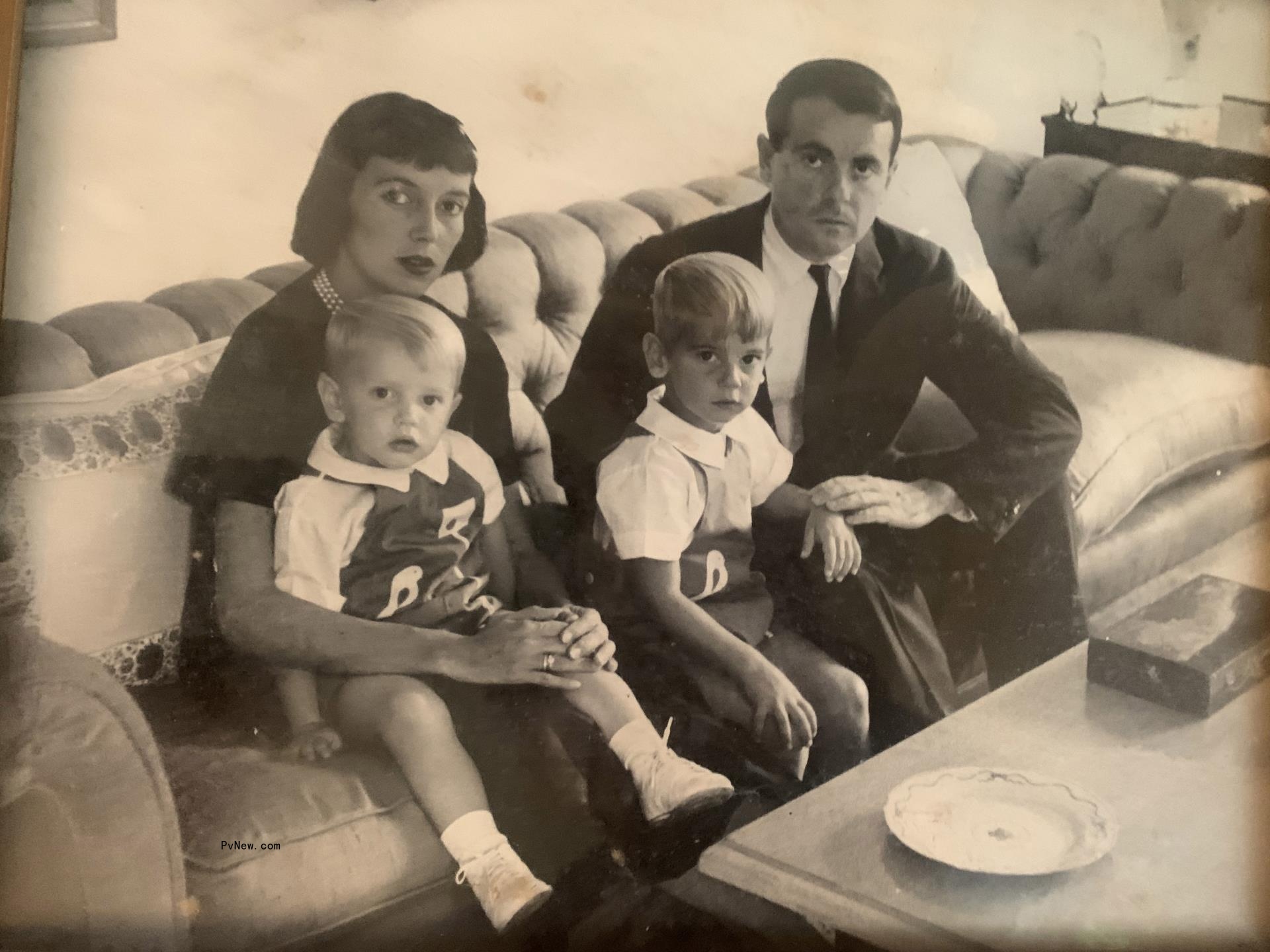 Griffin Dunne as a child with his parents and brother, all sitting on a sofa