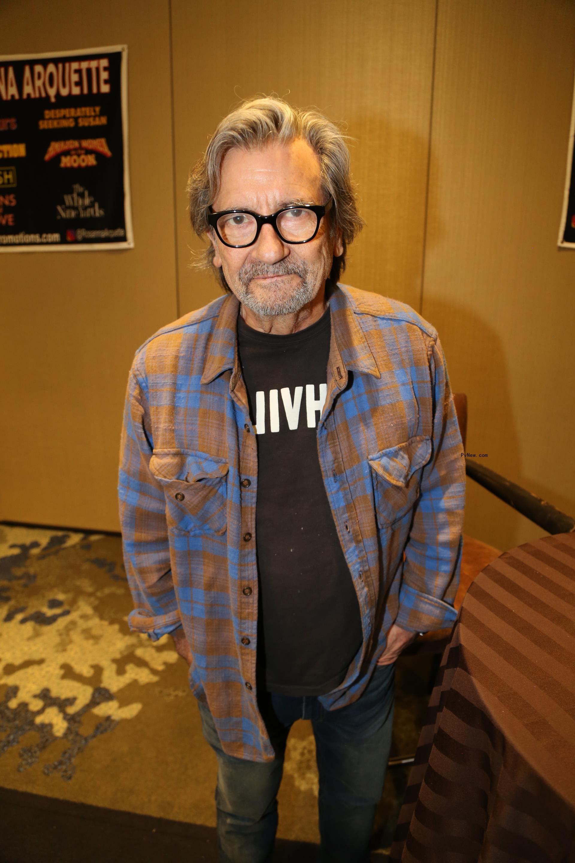 Griffin Dunne standing
