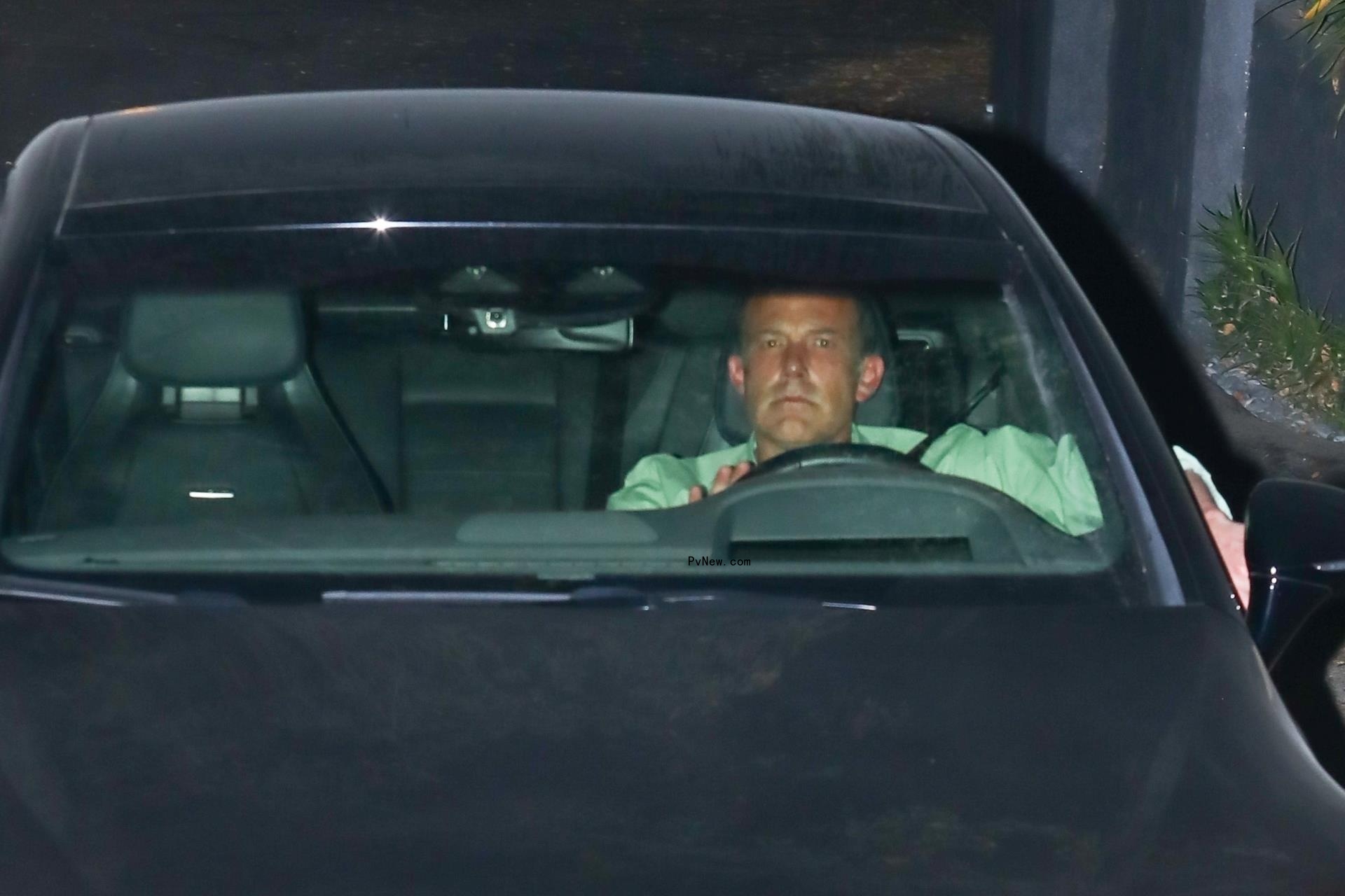 Ben Affleck leaving his and Jennifer Lopez's marital home.