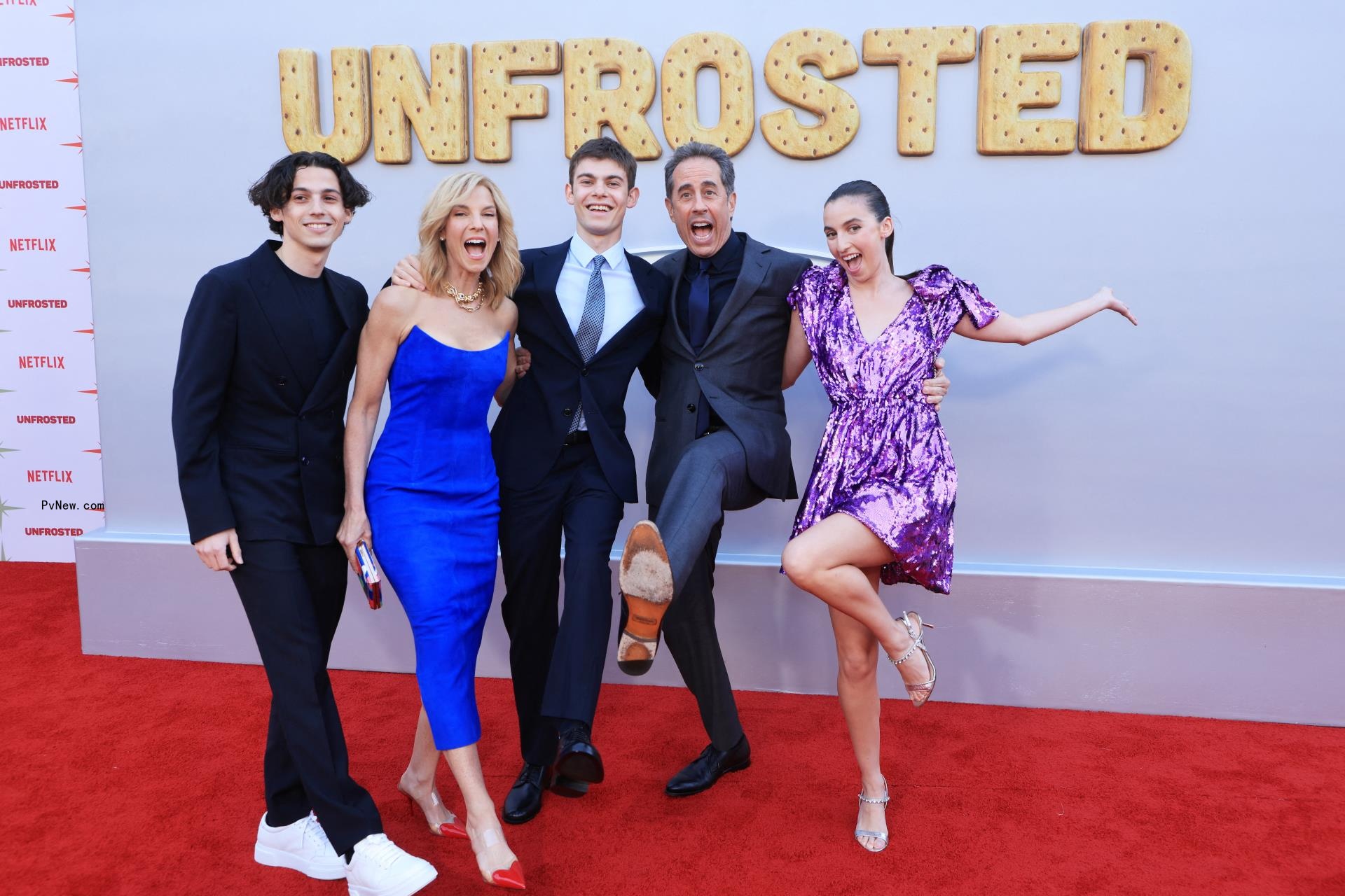 Jerry and Jessica Seinfeld with their kids Julian, Shepard, and Sascha on a red carpet.
