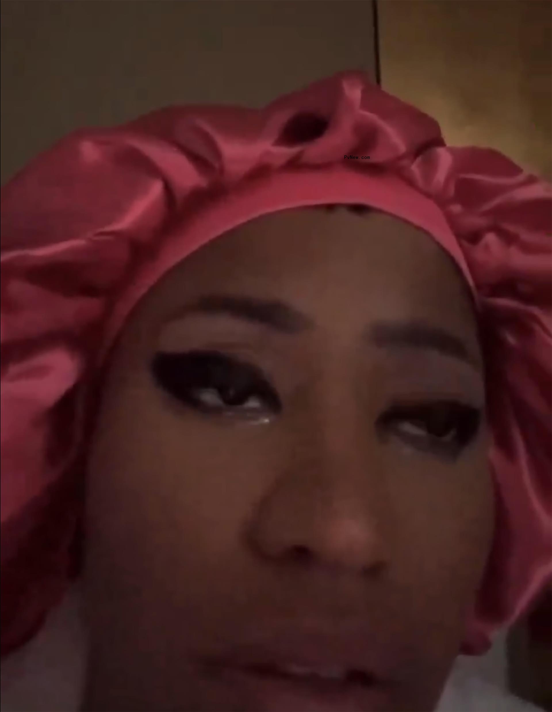 Nicki Minaj wearing a pink bonnet.