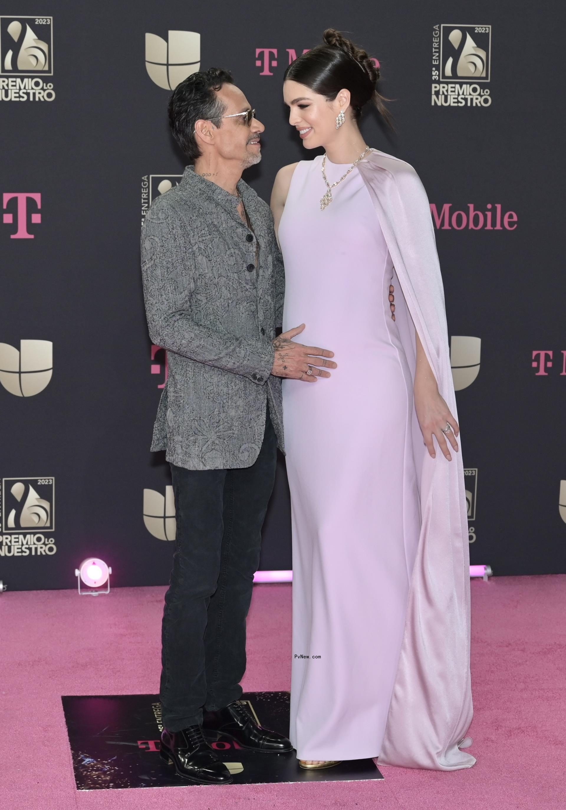 Nadia Ferreira and Marc Anthony on a red carpet in 2023.