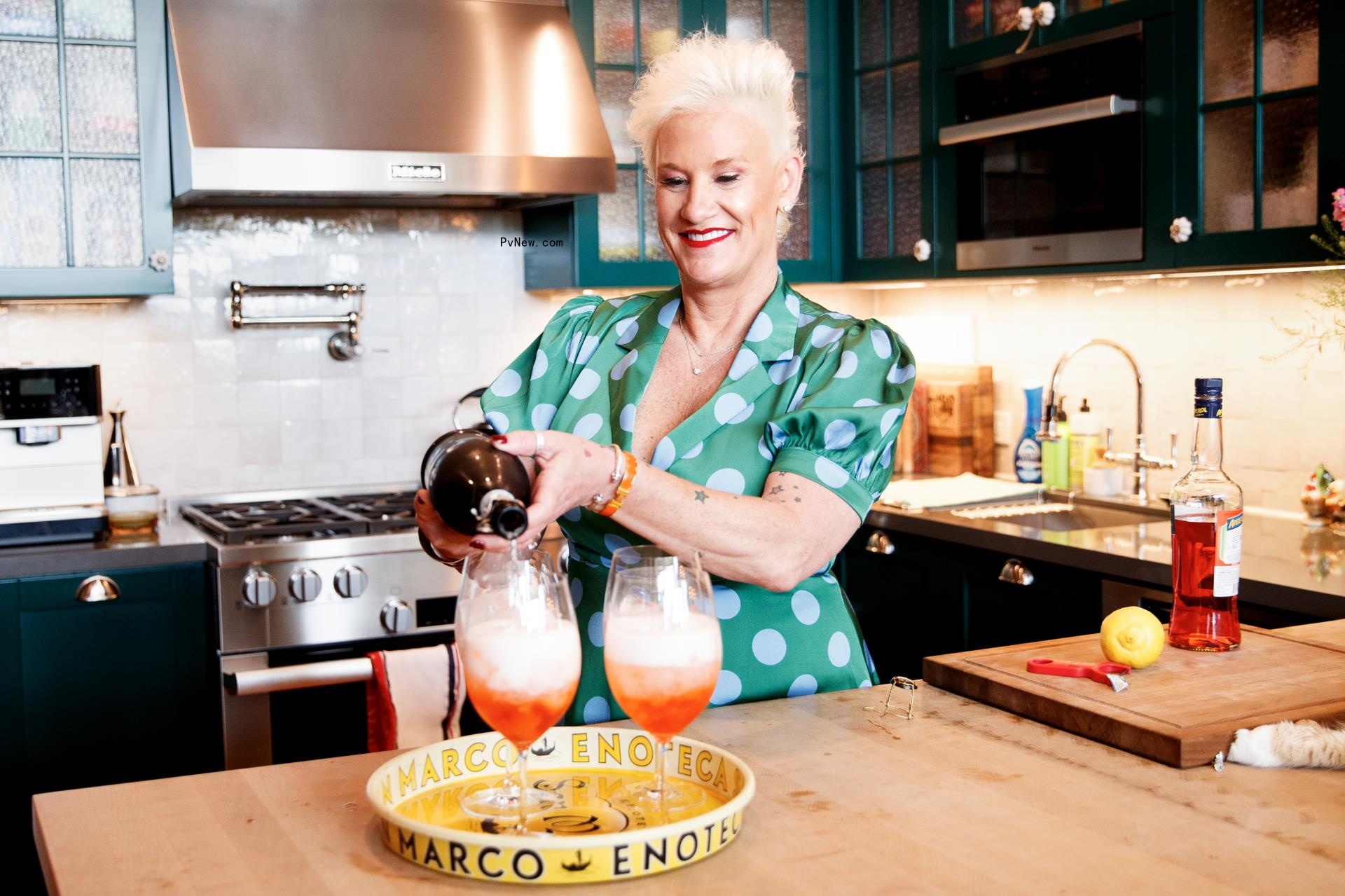 Anne Burrell pouring drinks in her Brooklyn kitchen. 