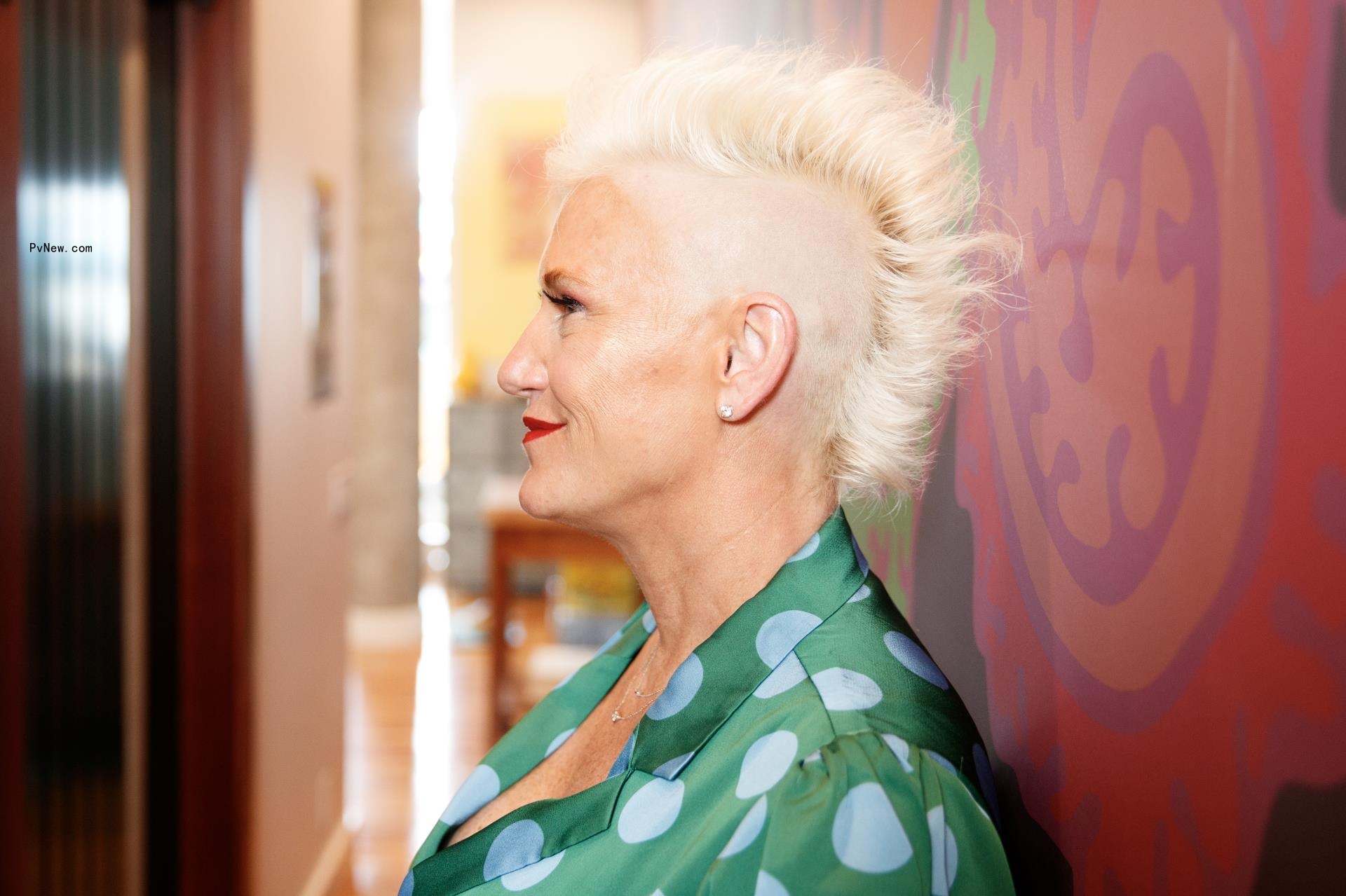 Anne Burrell standing in her Brooklyn hallway.
