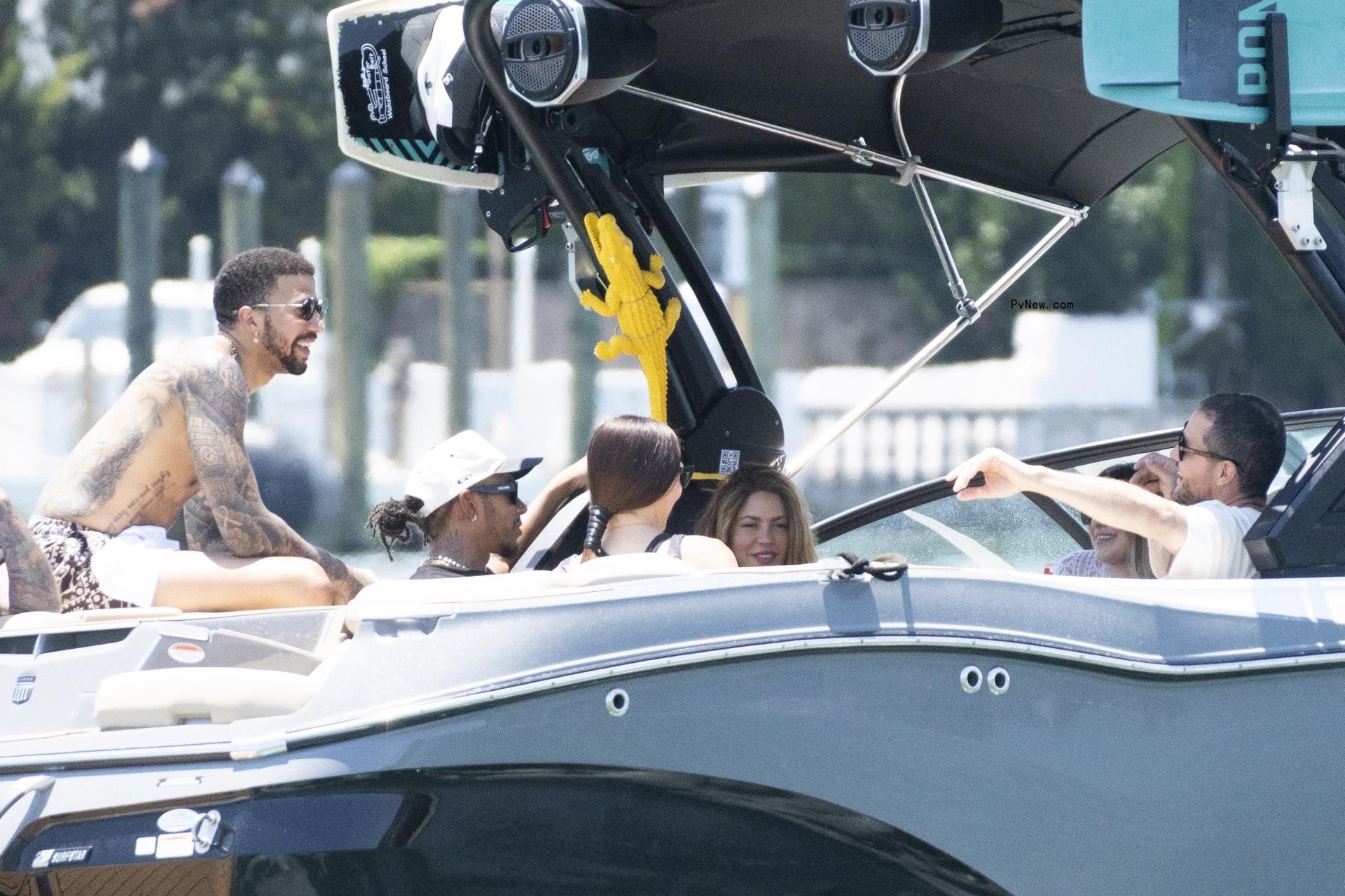 Shakira and Lewis Hamilton in a boat. 