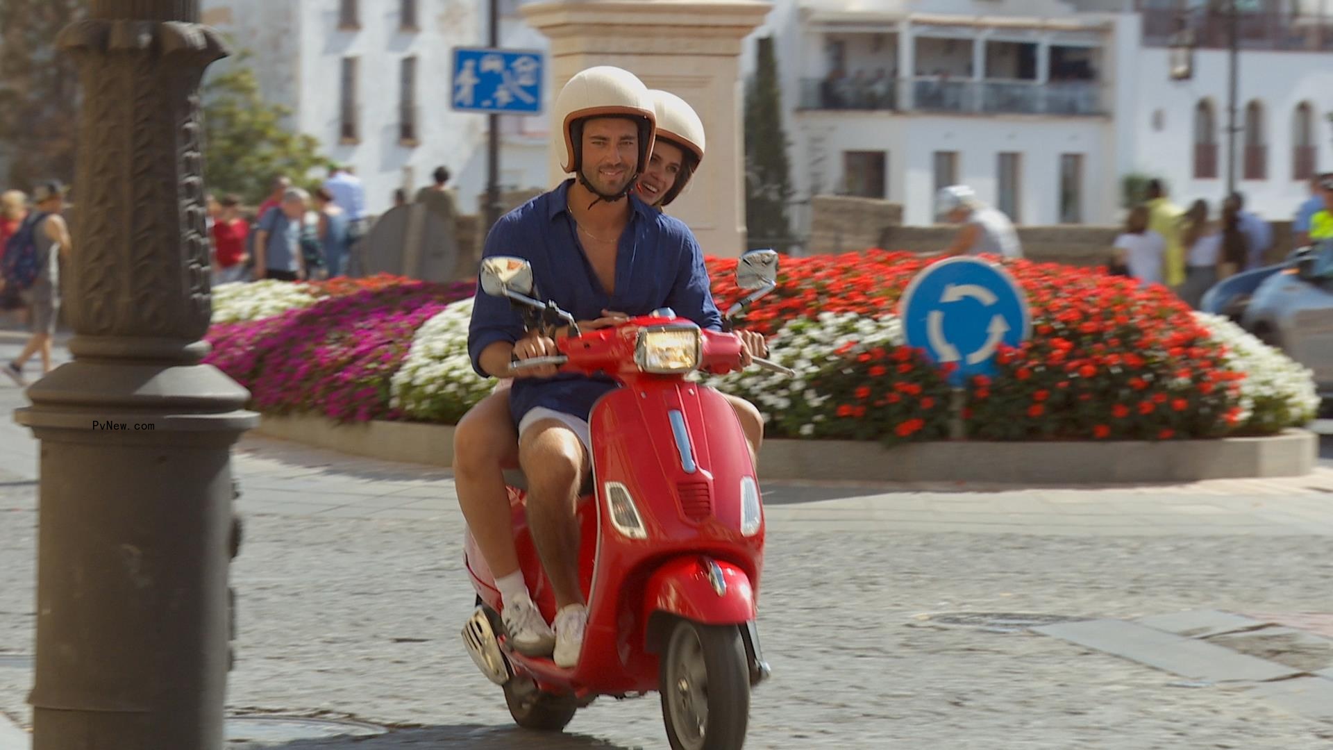 Joey Graziadei and Kelsey Anderson on a vespa