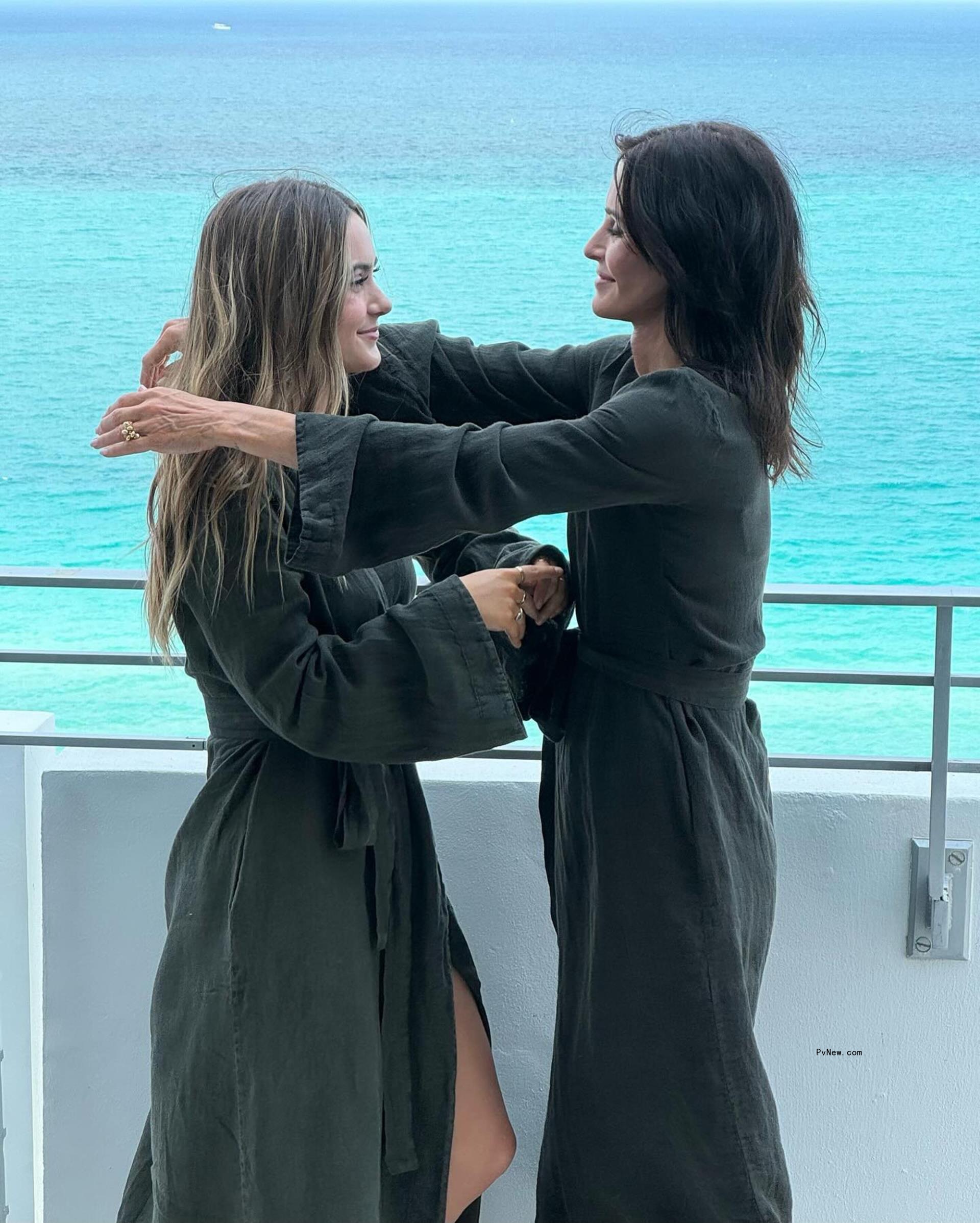 Courteney Cox and Coco Arquette  in matching robes.