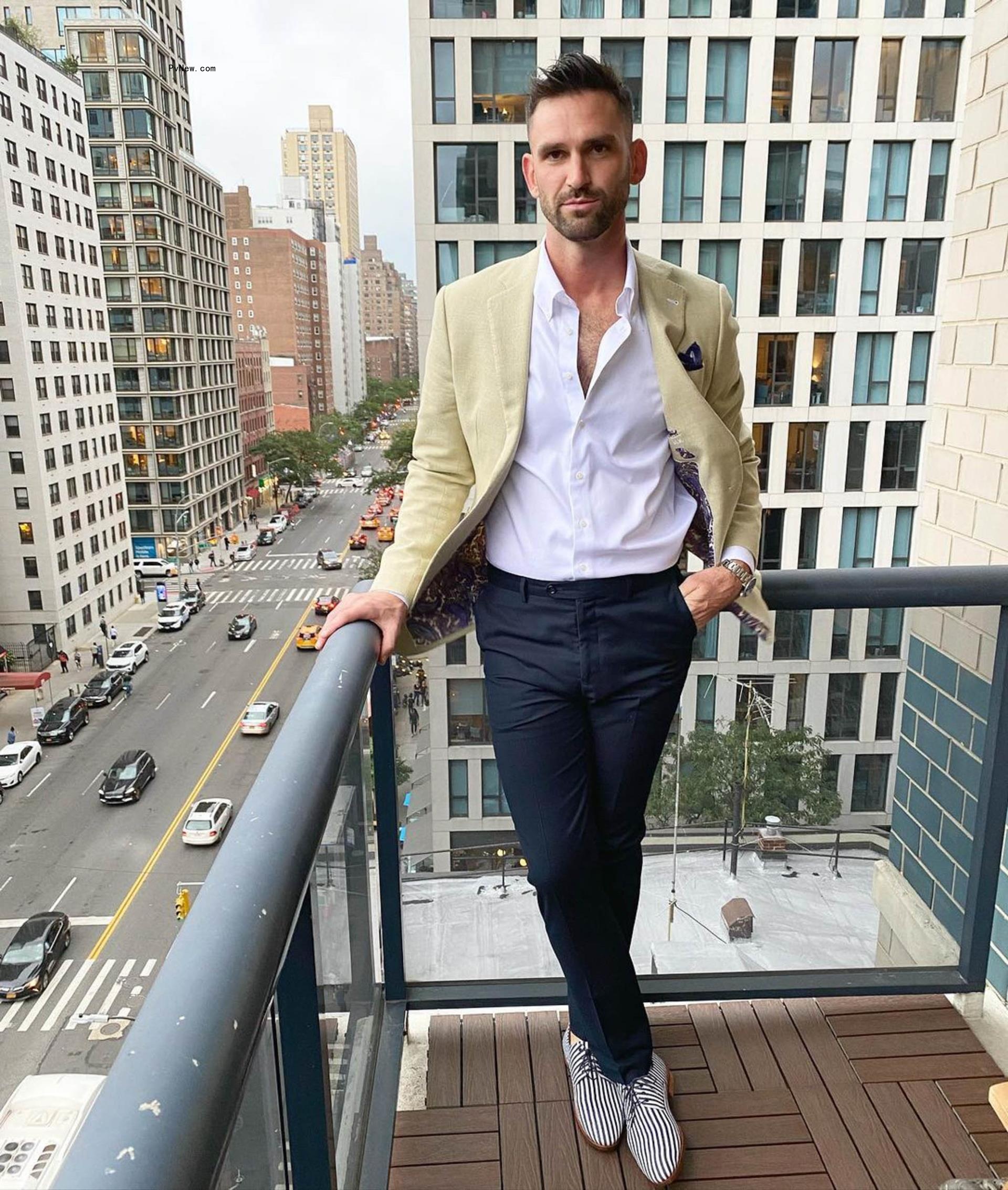 Carl Radke posing on a balcony