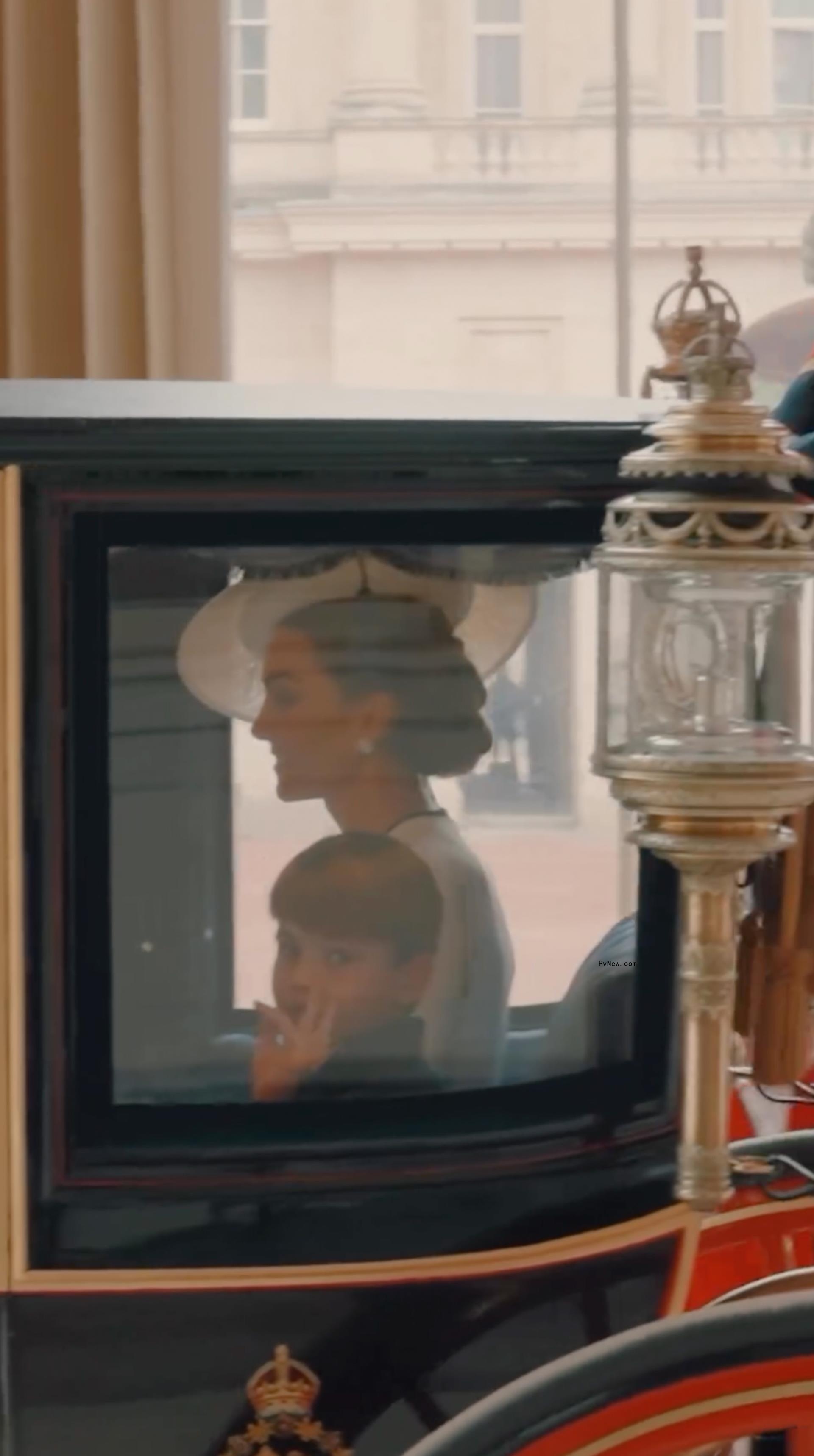 Prince Louis waving.