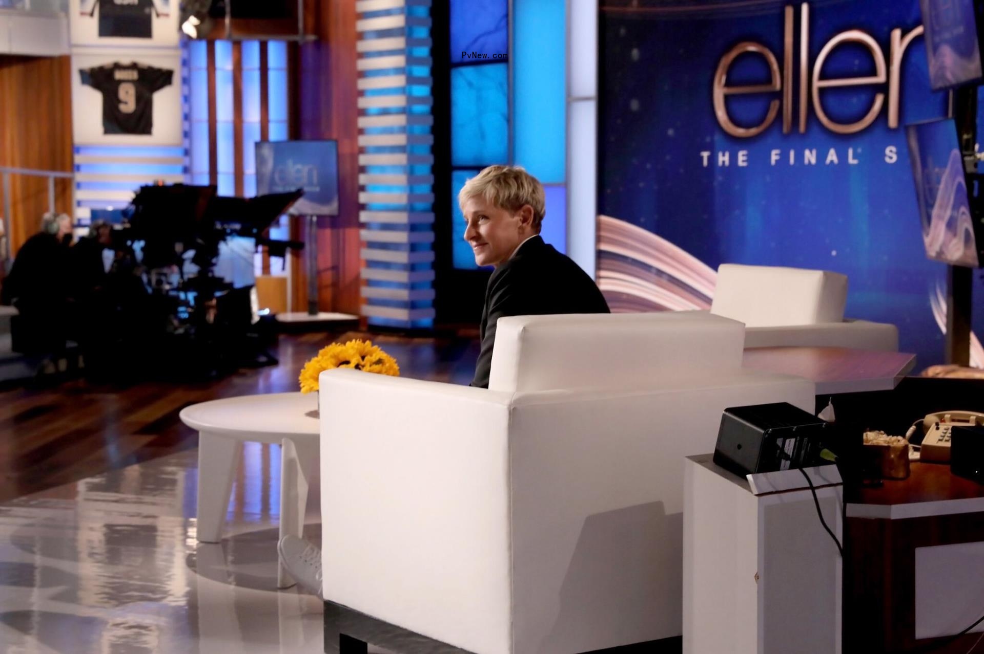 Ellen DeGeneres looks sad on her final show, sitting in a white chair.