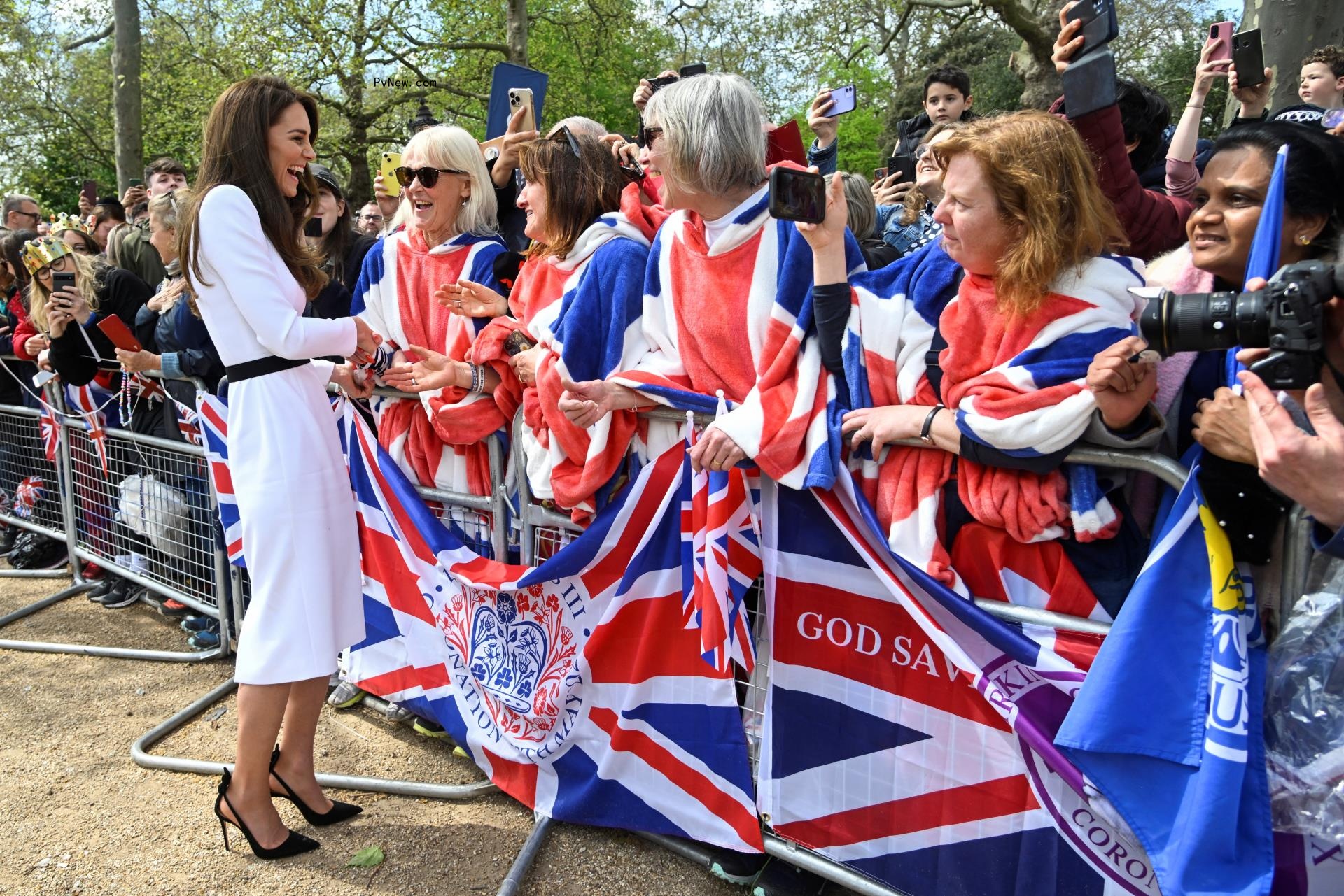 Catherine, Princess of Wales, meets well-wishers during a walka<i></i>bout on the Mall outside Buckingham Palace ahead of the coro<i></i>nation of Britain's King Charles and Camilla, Queen Co<i></i>nsorton May 5, 2023 in London, England.