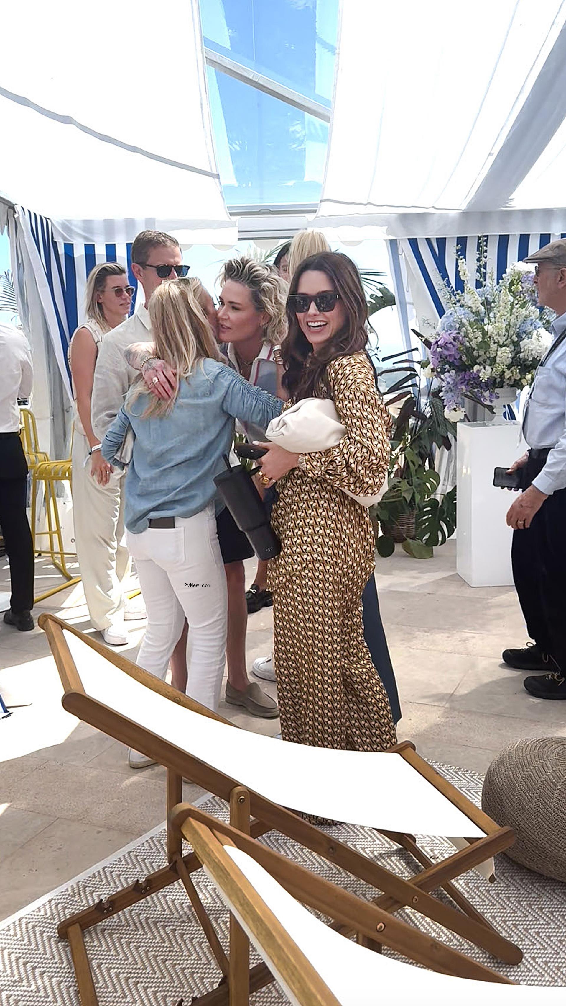 sophia bush, ashlyn harris hugging another woman