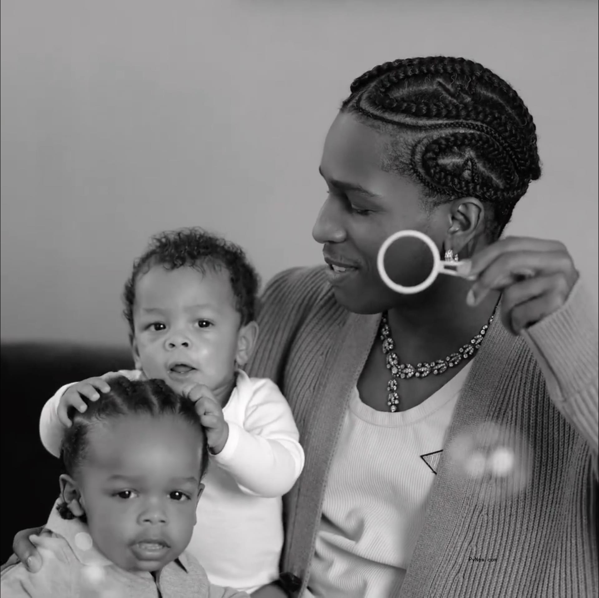 A$AP Rocky blowing bubbles with his sons, Riot and RZA.