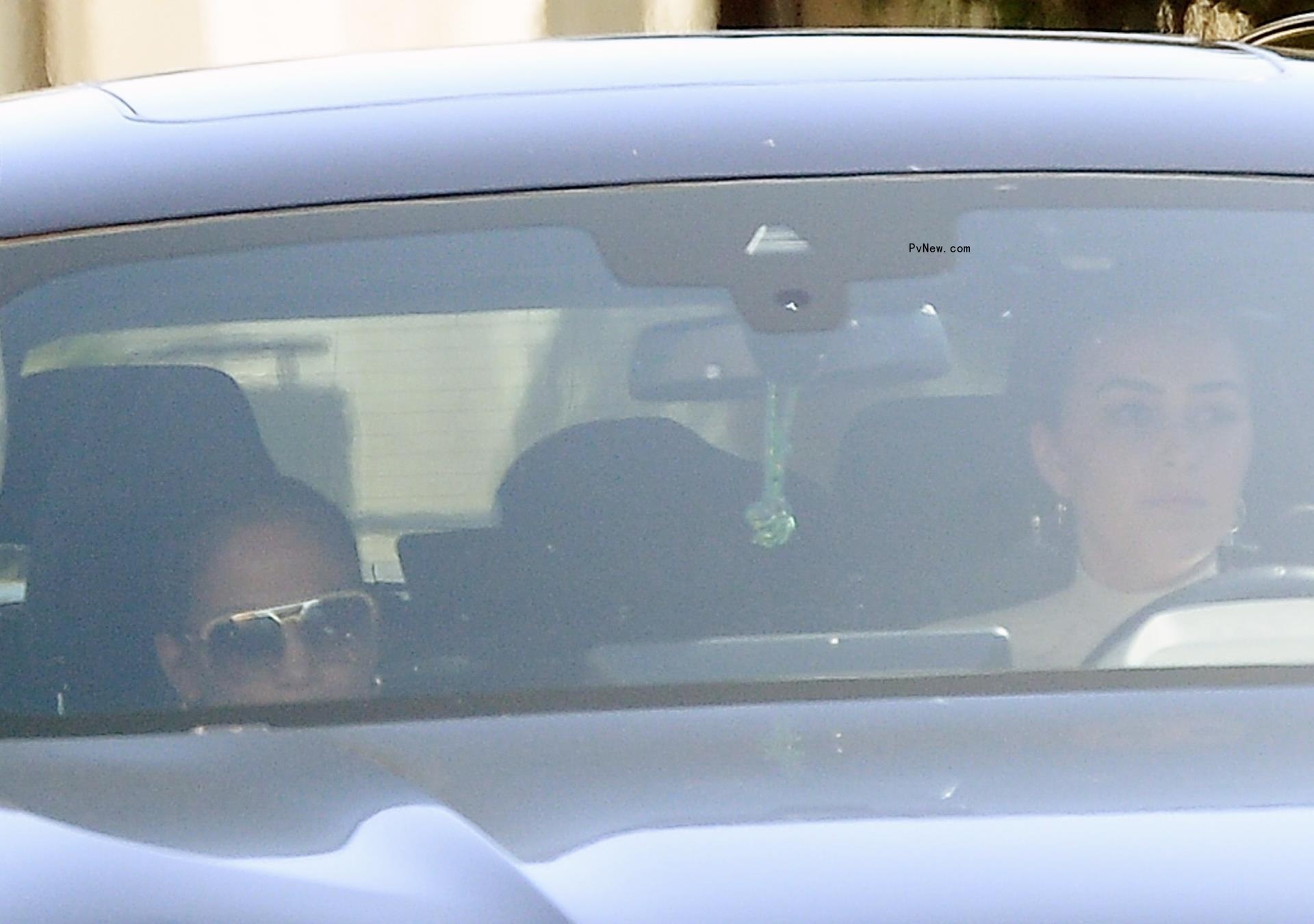 Jennifer Lopez in the passenger seat of a car