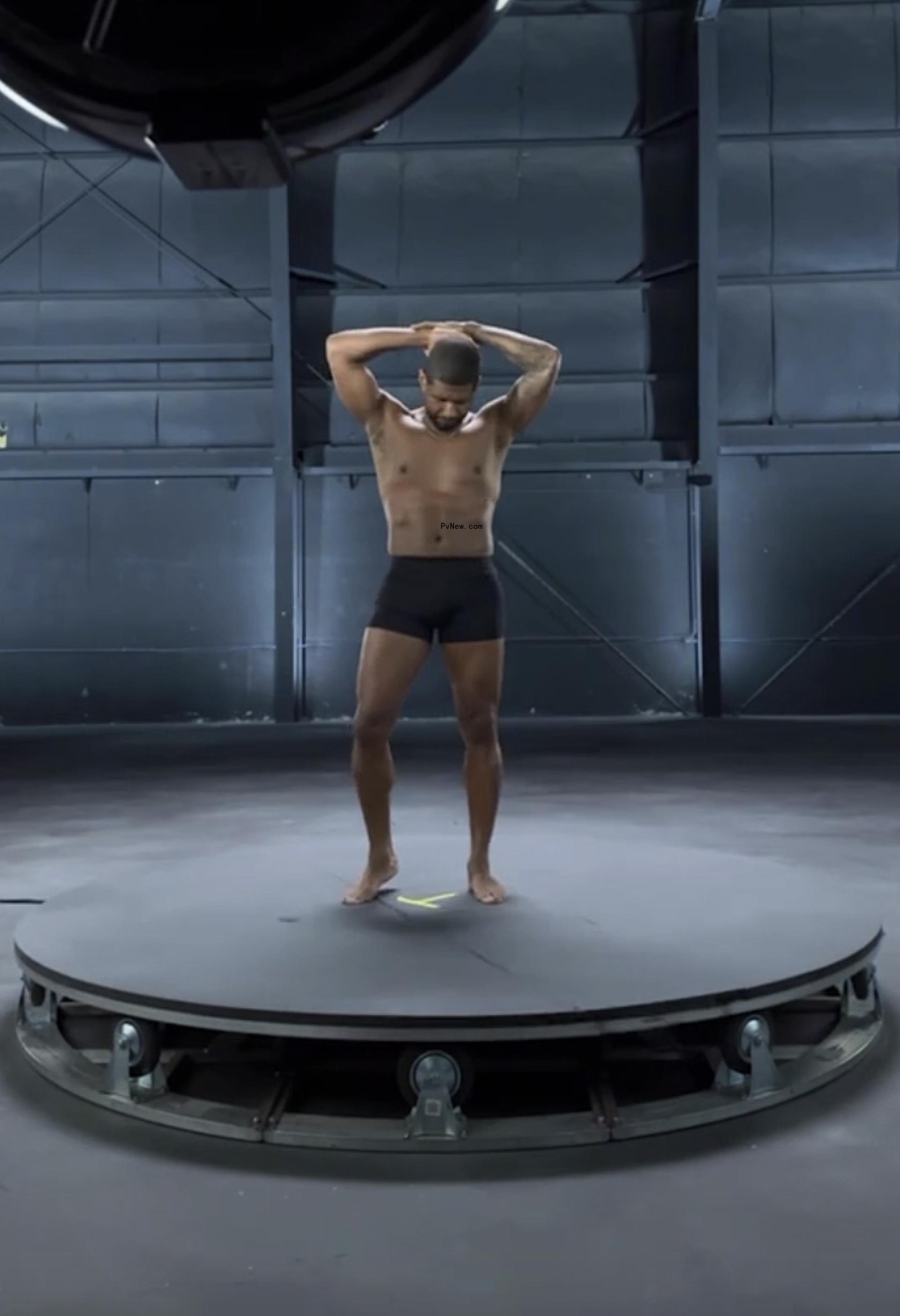 A shirtless Usher.