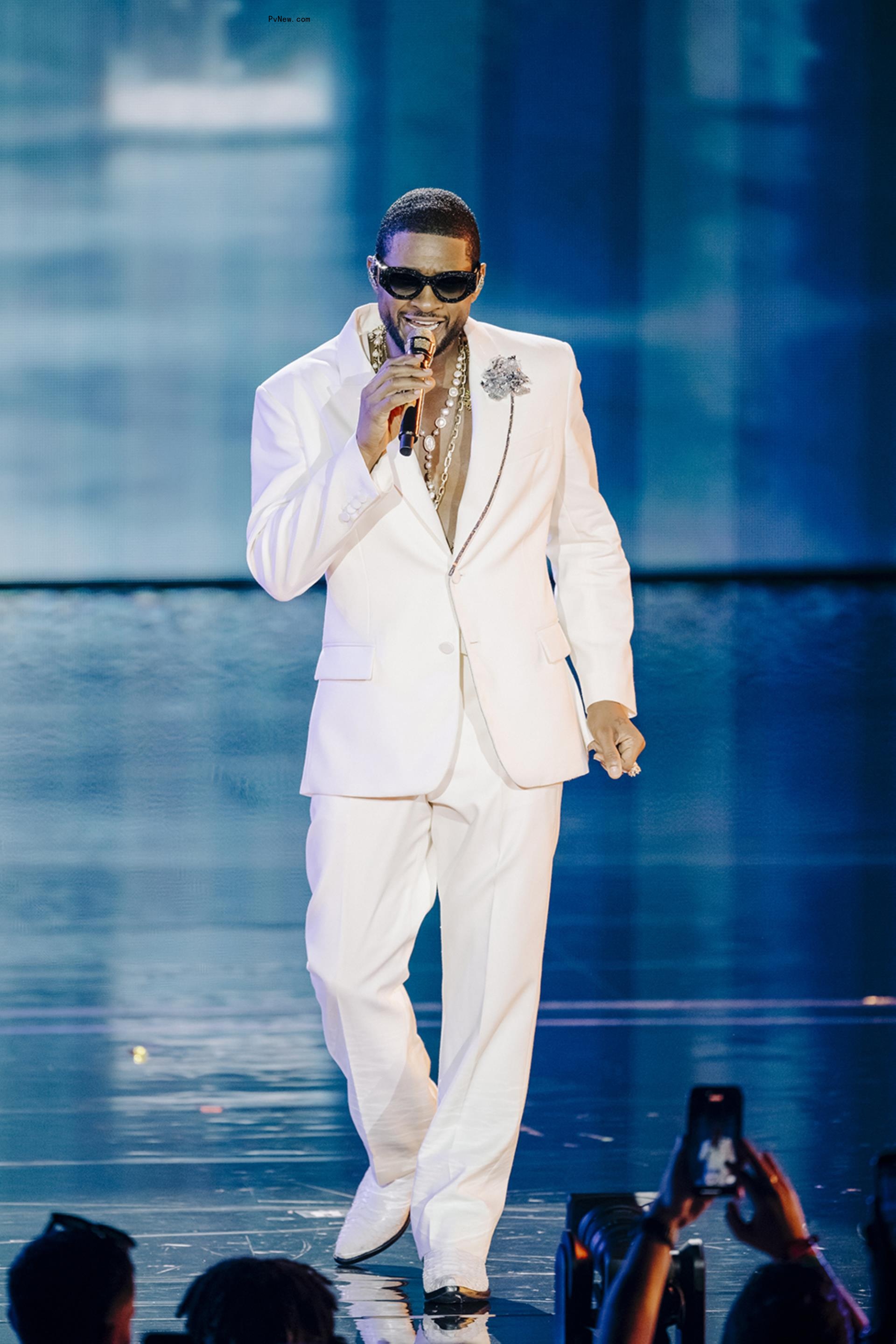 Usher performing in 2023.