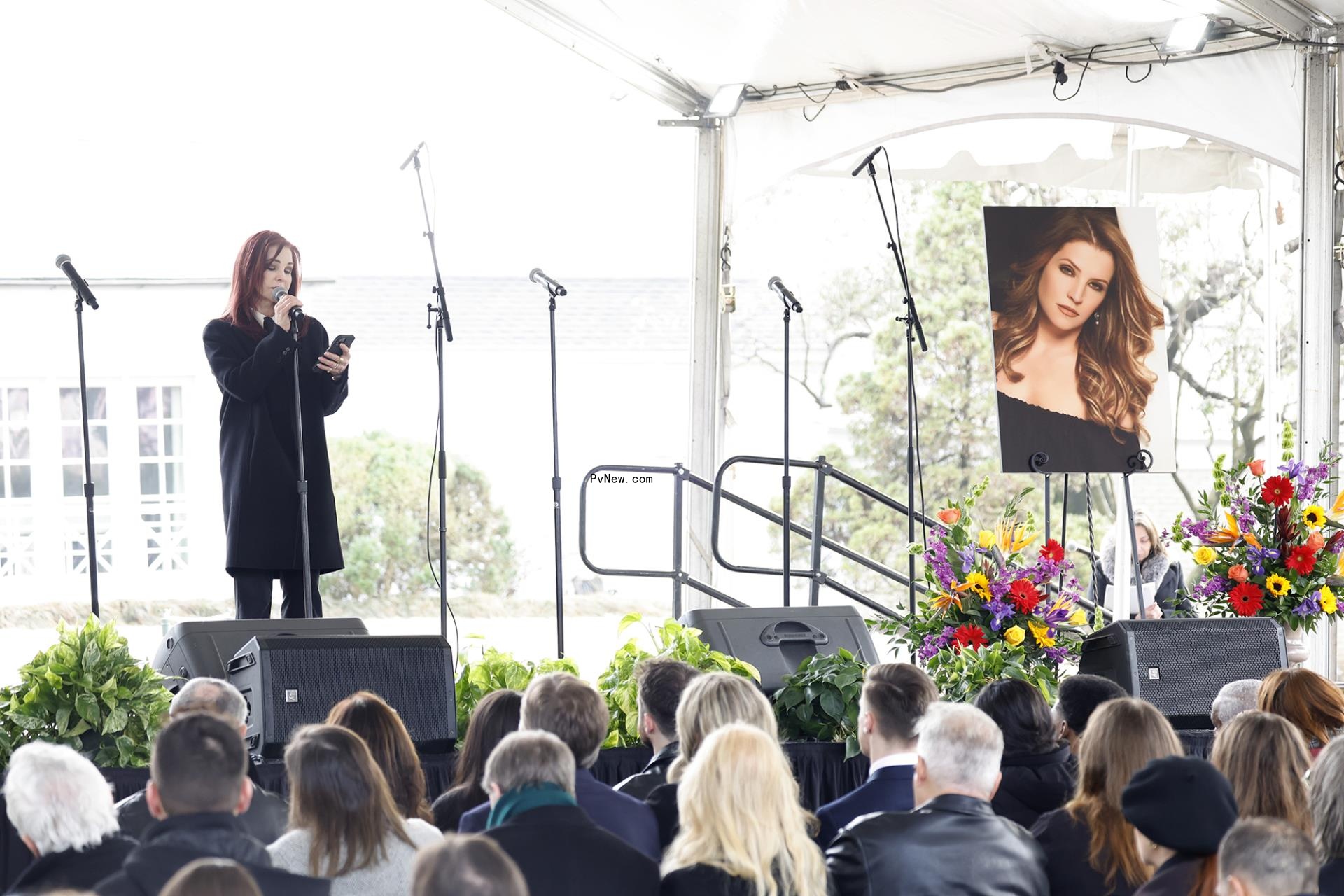 Priscilla Presley talks to the crowd at the memorial at Graceland for Lisa Marie Presley in January 2023.