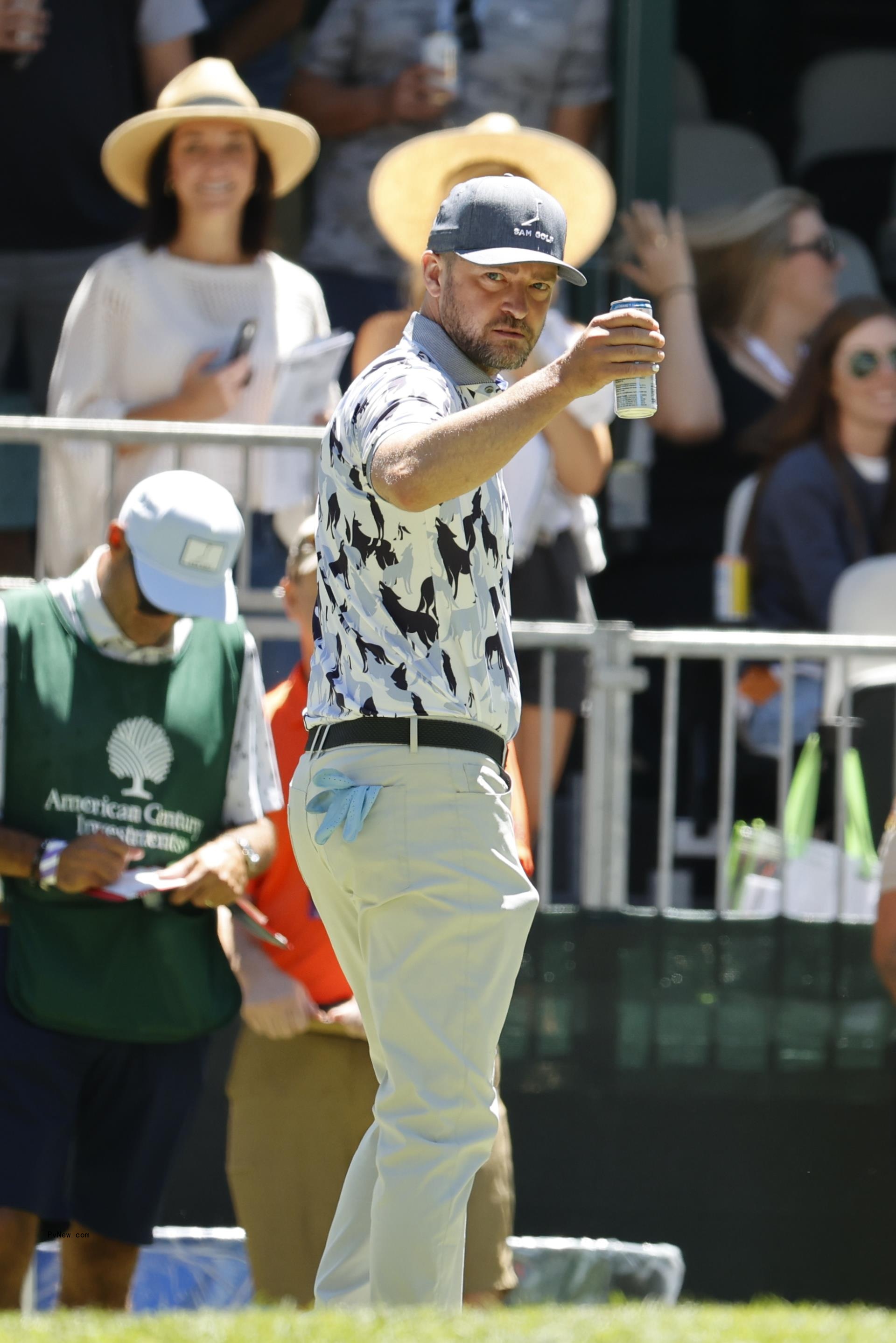 Justin Timberlake drinking a beer. 