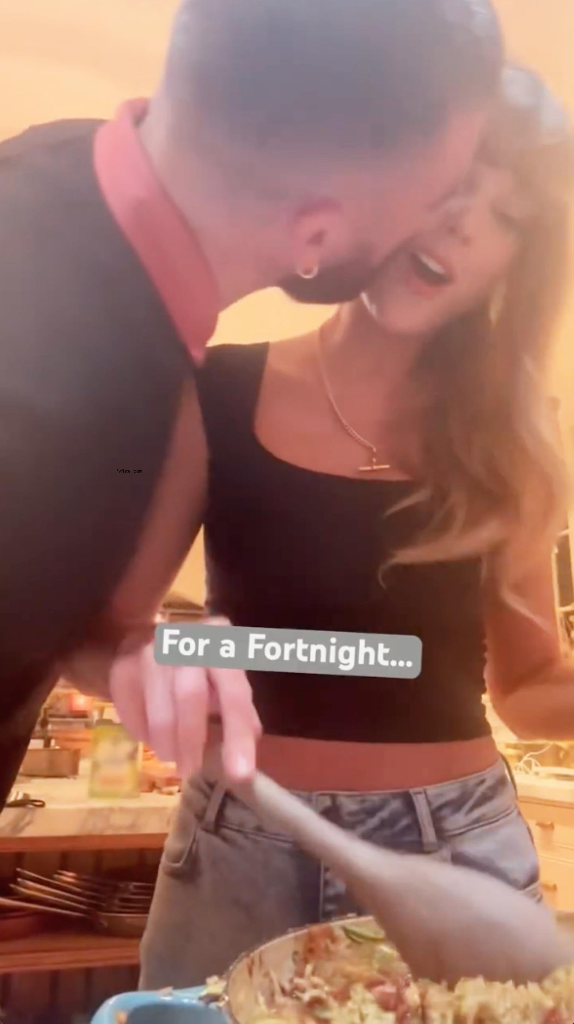 Travis Kelce and Taylor Swift cooking together.