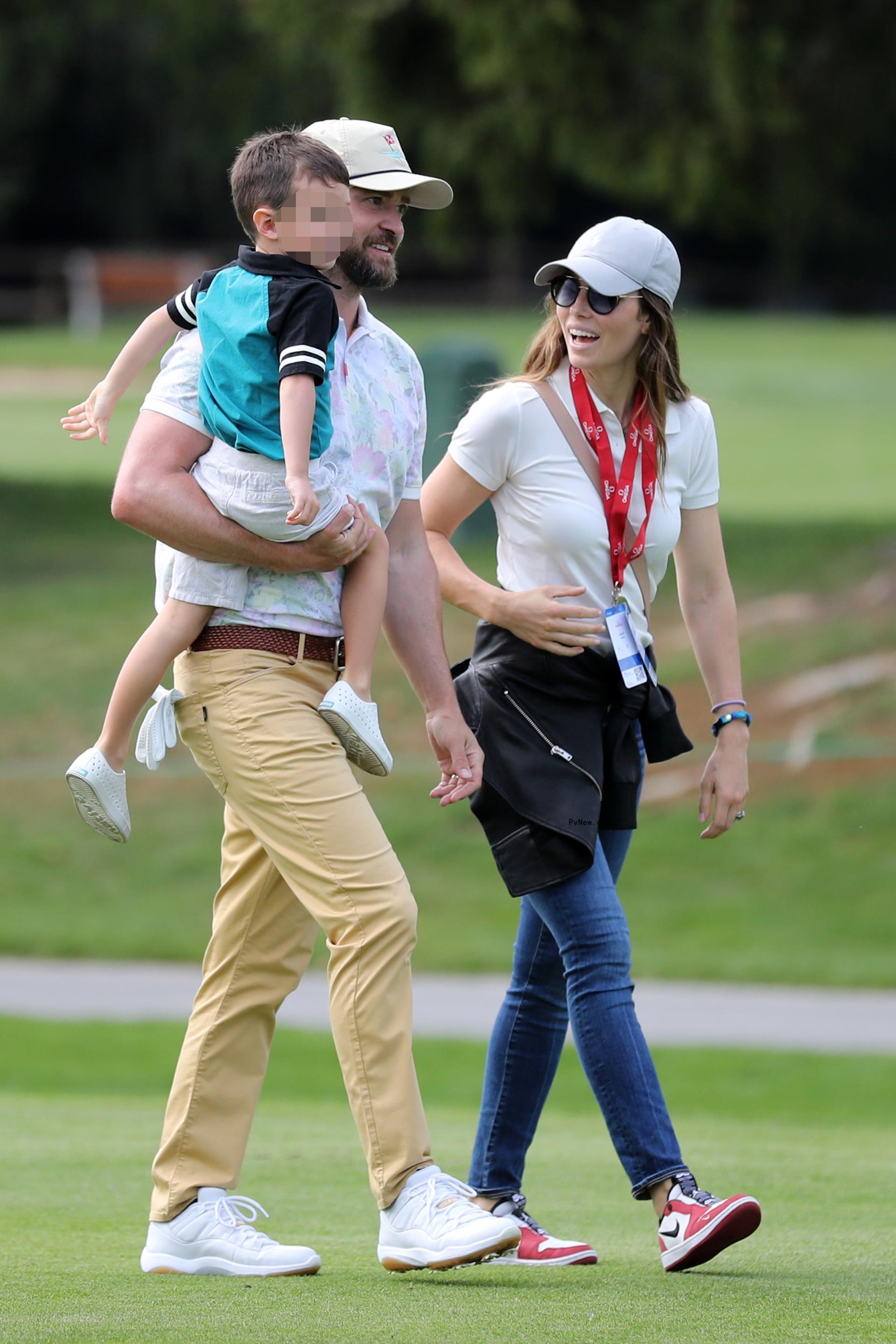 Justin Timberlake and Jessica Biel walking with their son