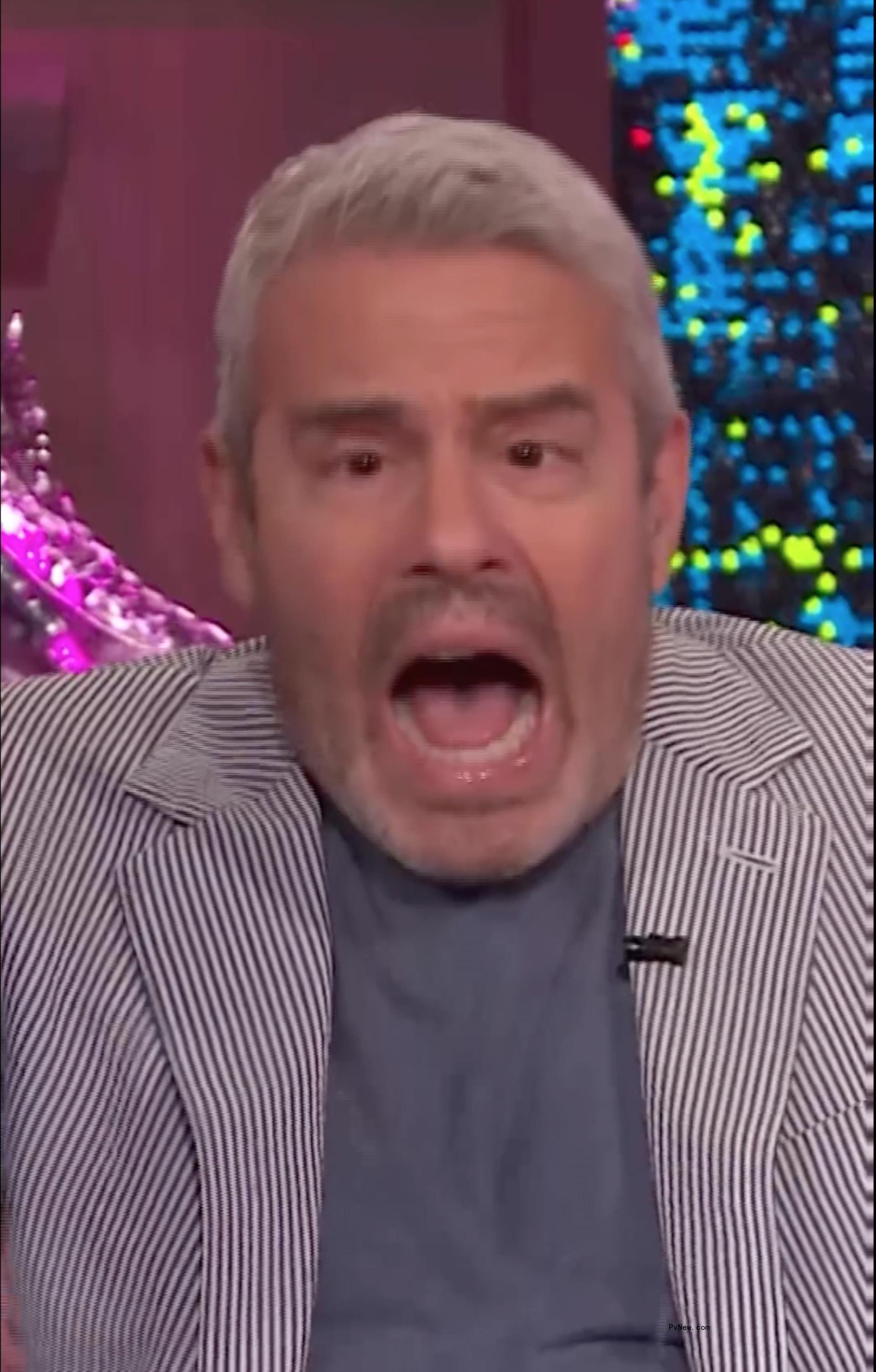 Andy Cohen being hit with a bottle on 