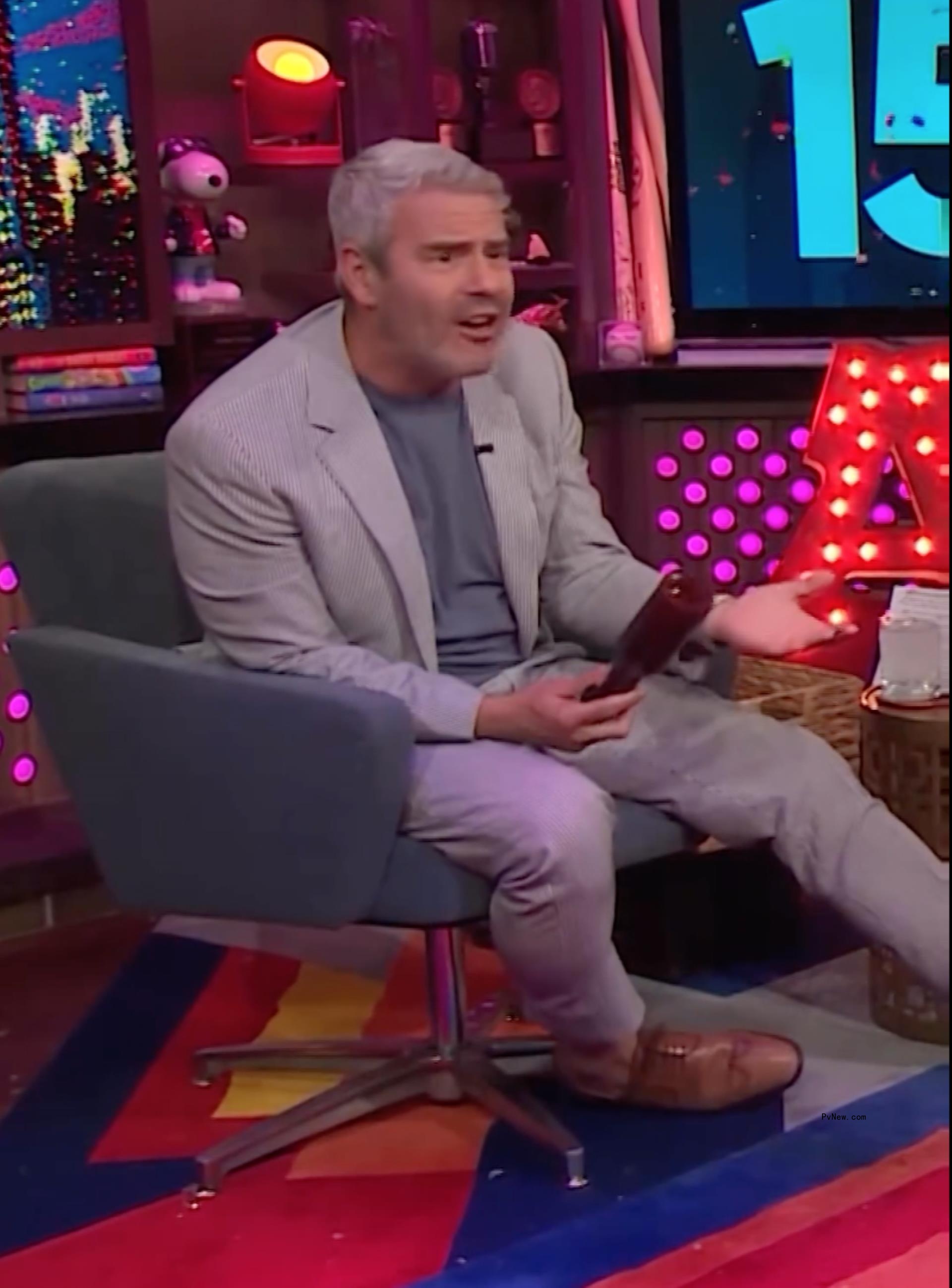 Andy Cohen being hit with a bottle on 