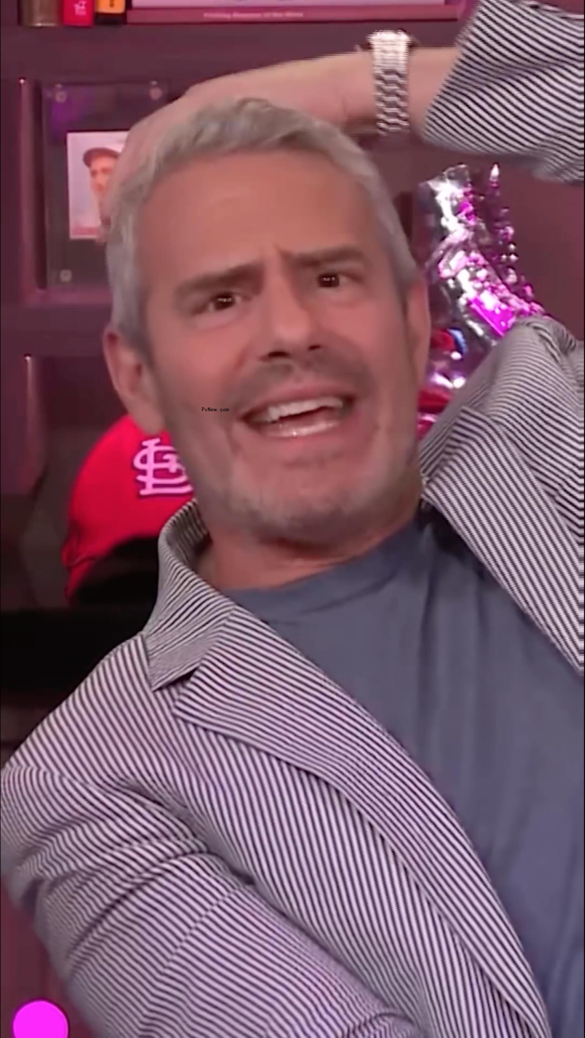 Andy Cohen being hit with a bottle on 